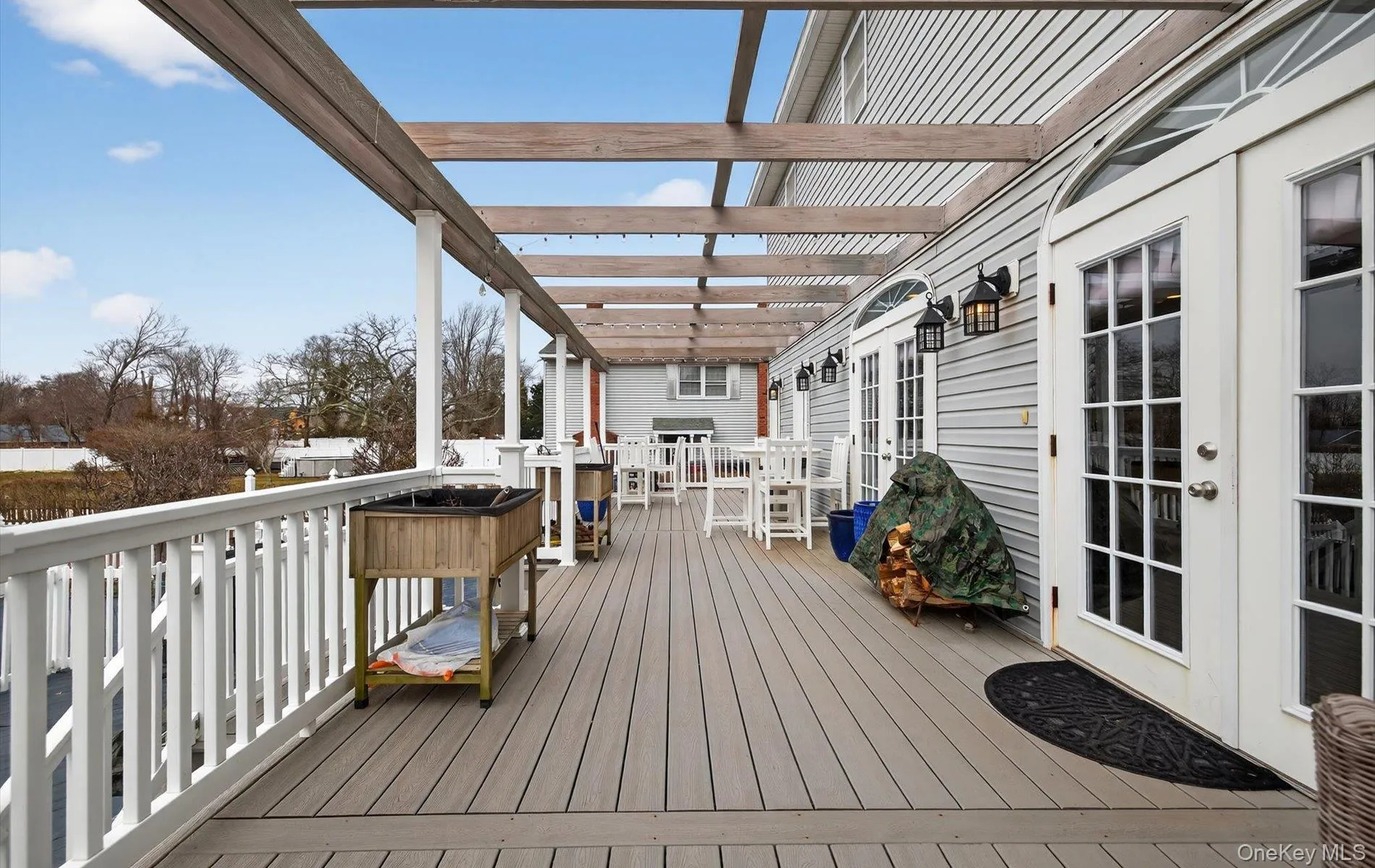Deck with french doors and outdoor dining area Deck with french doors and outdoor dining area