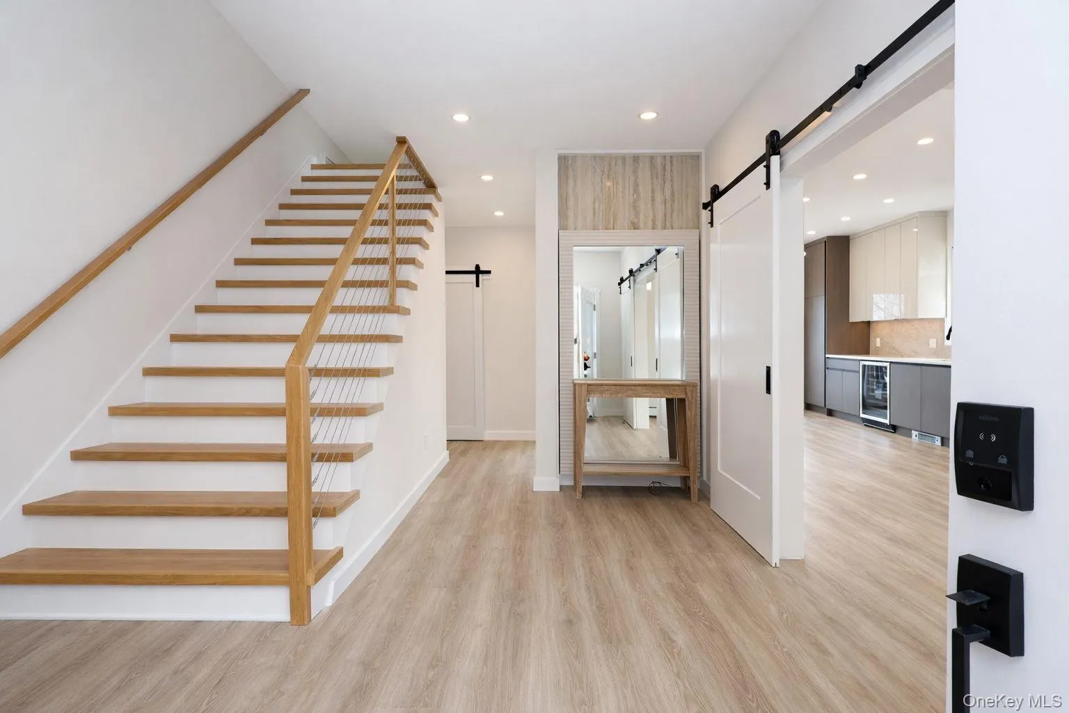 Foyer with large coat closet and extra wide stairs. Foyer with large coat closet and extra wide stairs.