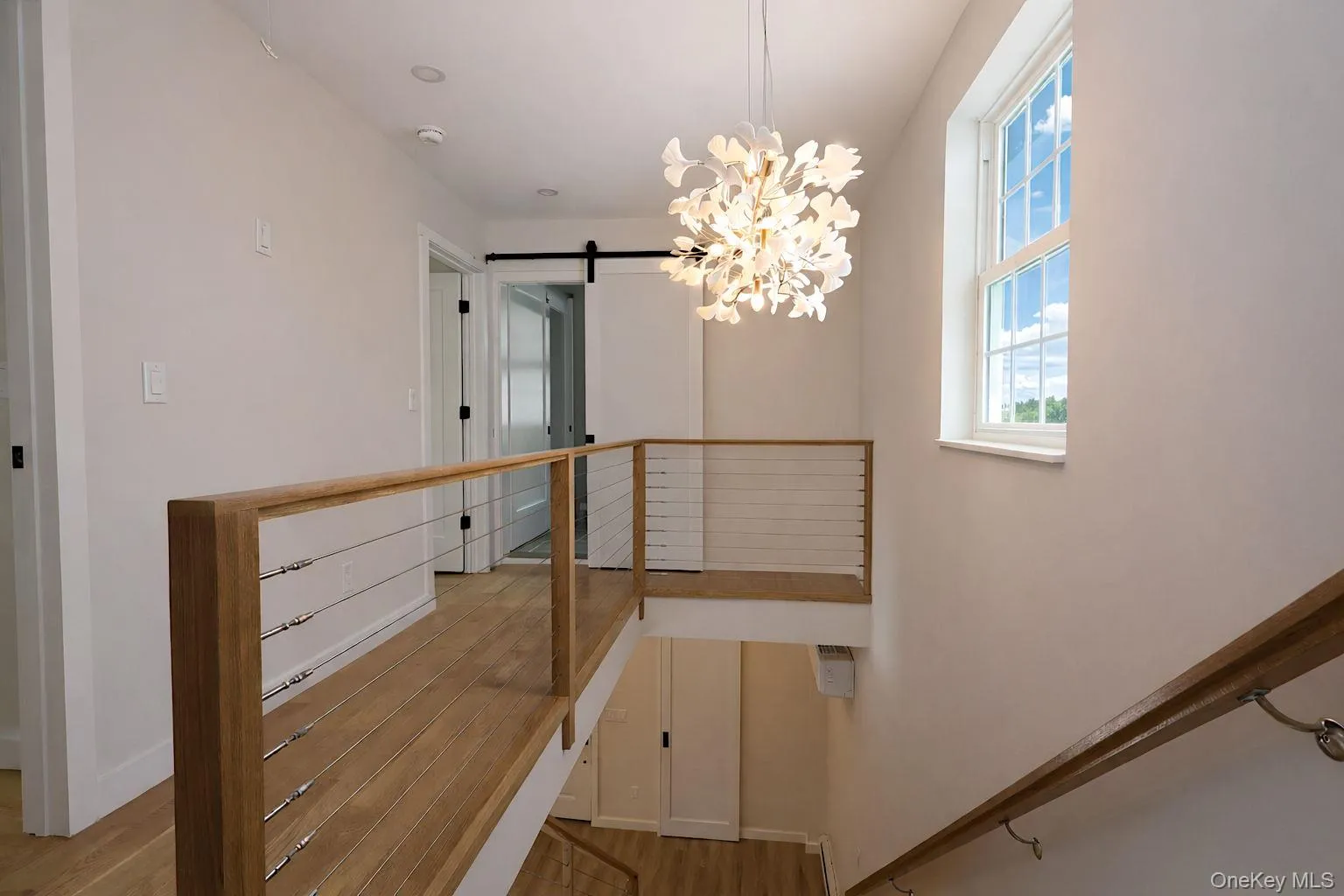 Stairwell to 2nd floor showing loft area Stairwell to 2nd floor showing loft area