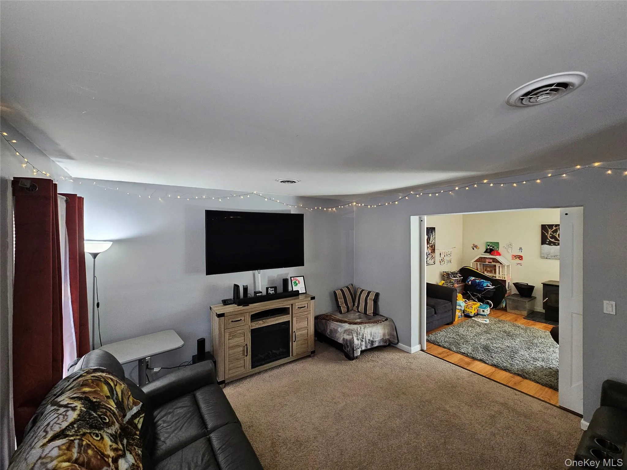 Living area with light colored carpet Living area with light colored carpet