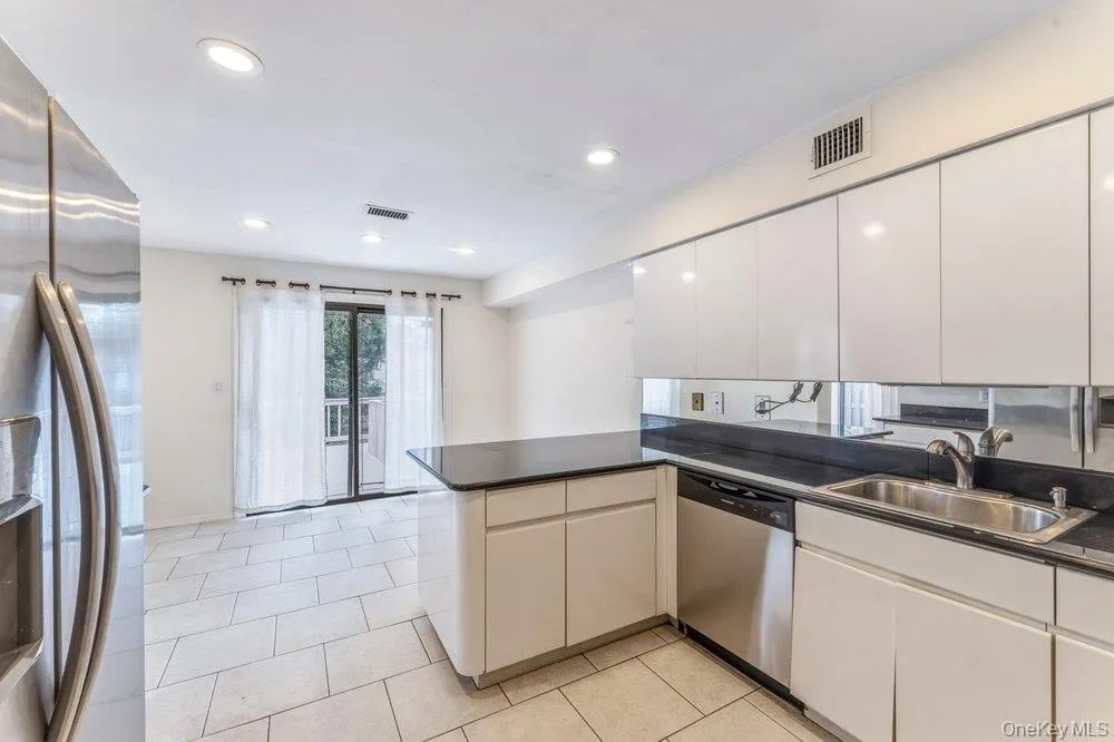 Kitchen leading to the rear deck Kitchen leading to the rear deck