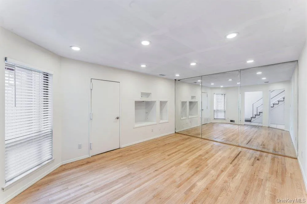 Den with wood flooring Den with wood flooring