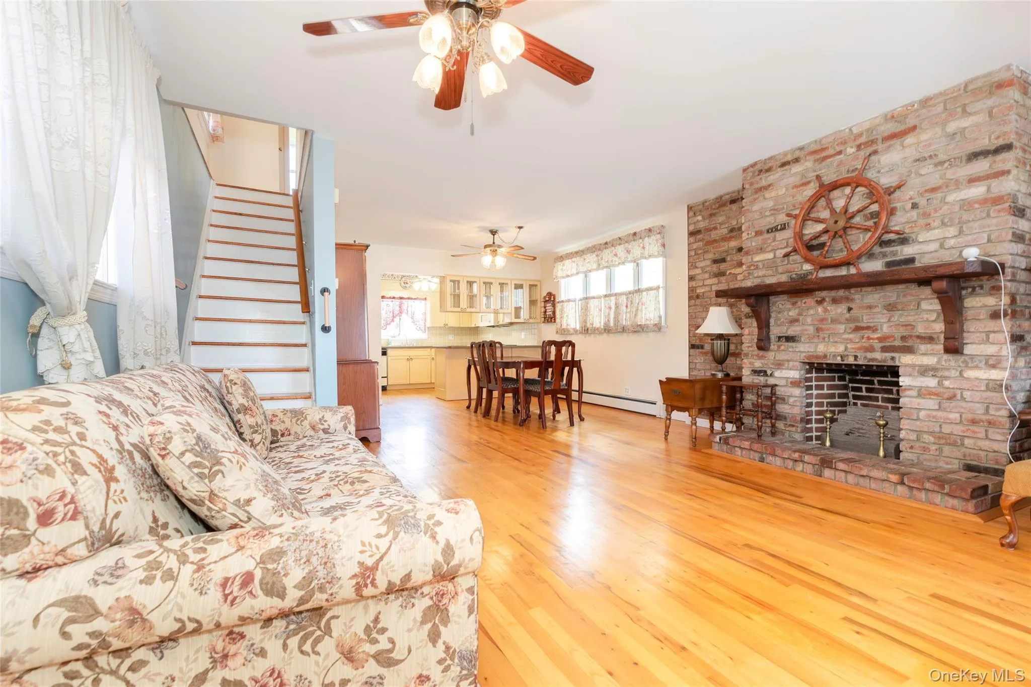 Open concept living room into dining room with gas fireplace Open concept living room into dining room with gas fireplace