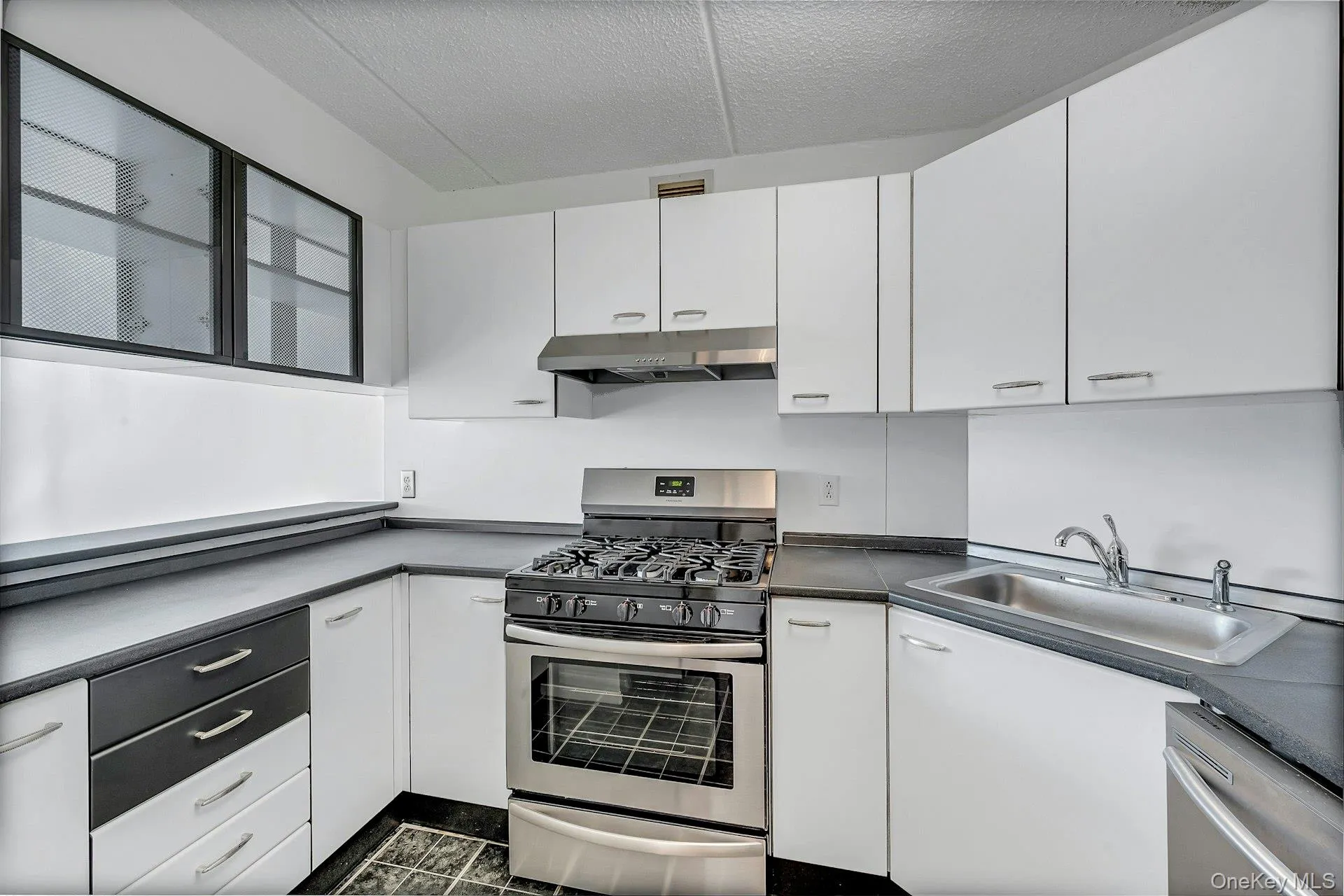 Kitchen with stainless steel appliances. Kitchen with stainless steel appliances.