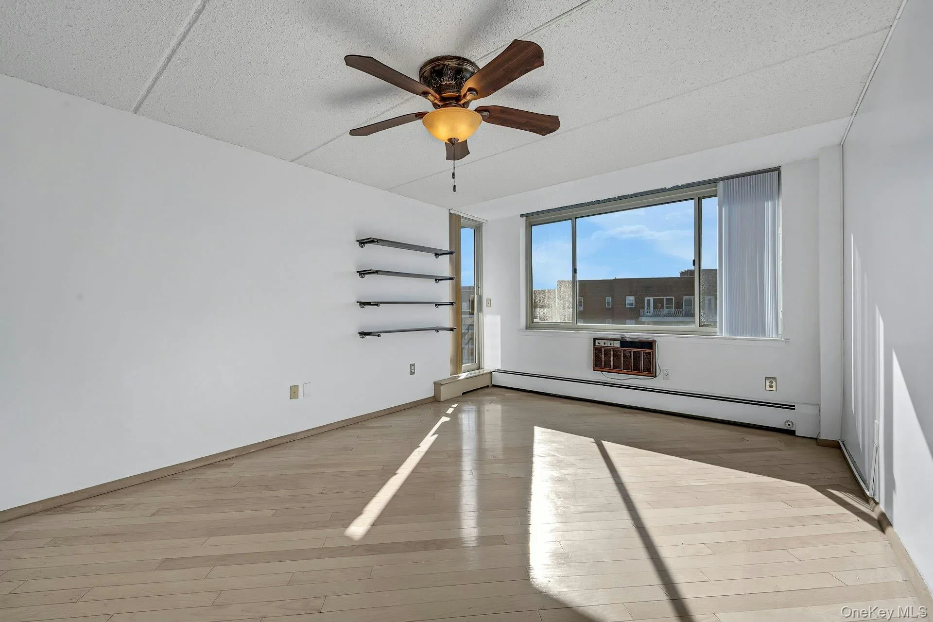 Living Room with door to the covered balcony. Living Room with door to the covered balcony.