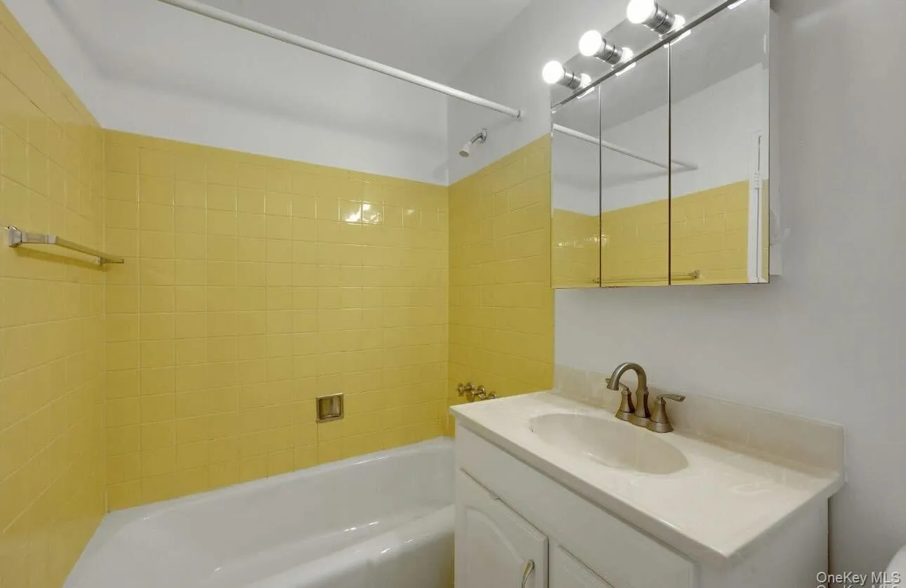 Full bathroom with vanity and shower / tub combination Full bathroom with vanity and shower / tub combination