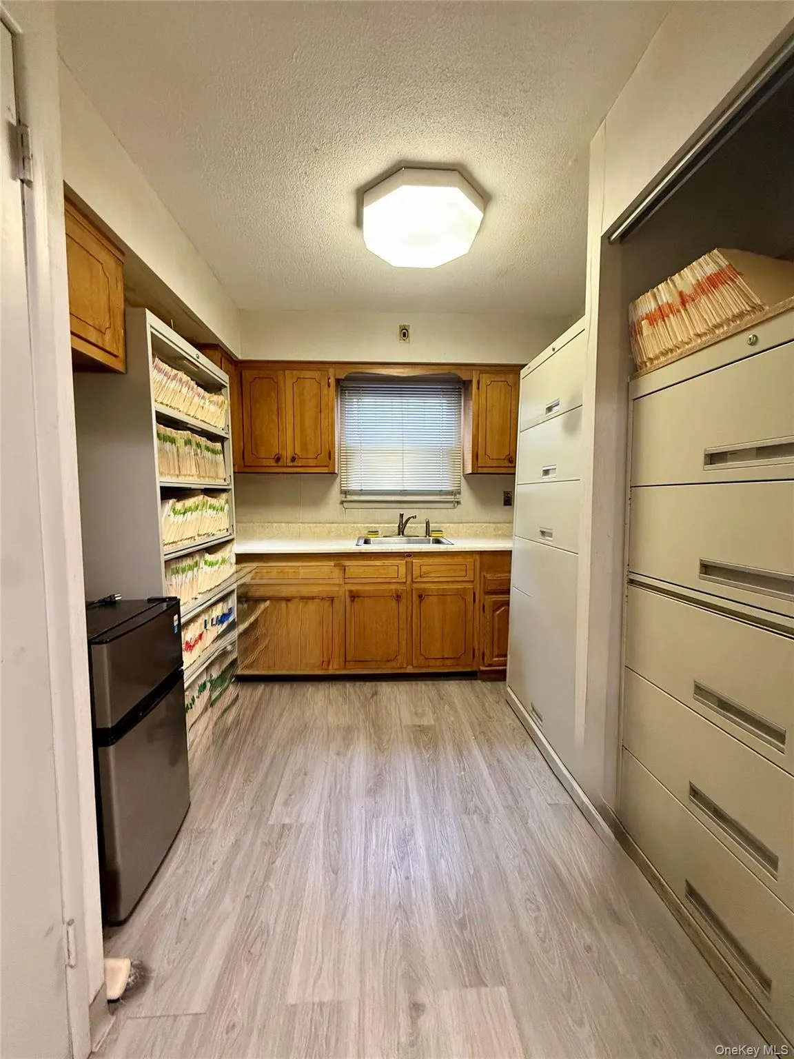 Kitchenette area with file cabinets if needed Kitchenette area with file cabinets if needed