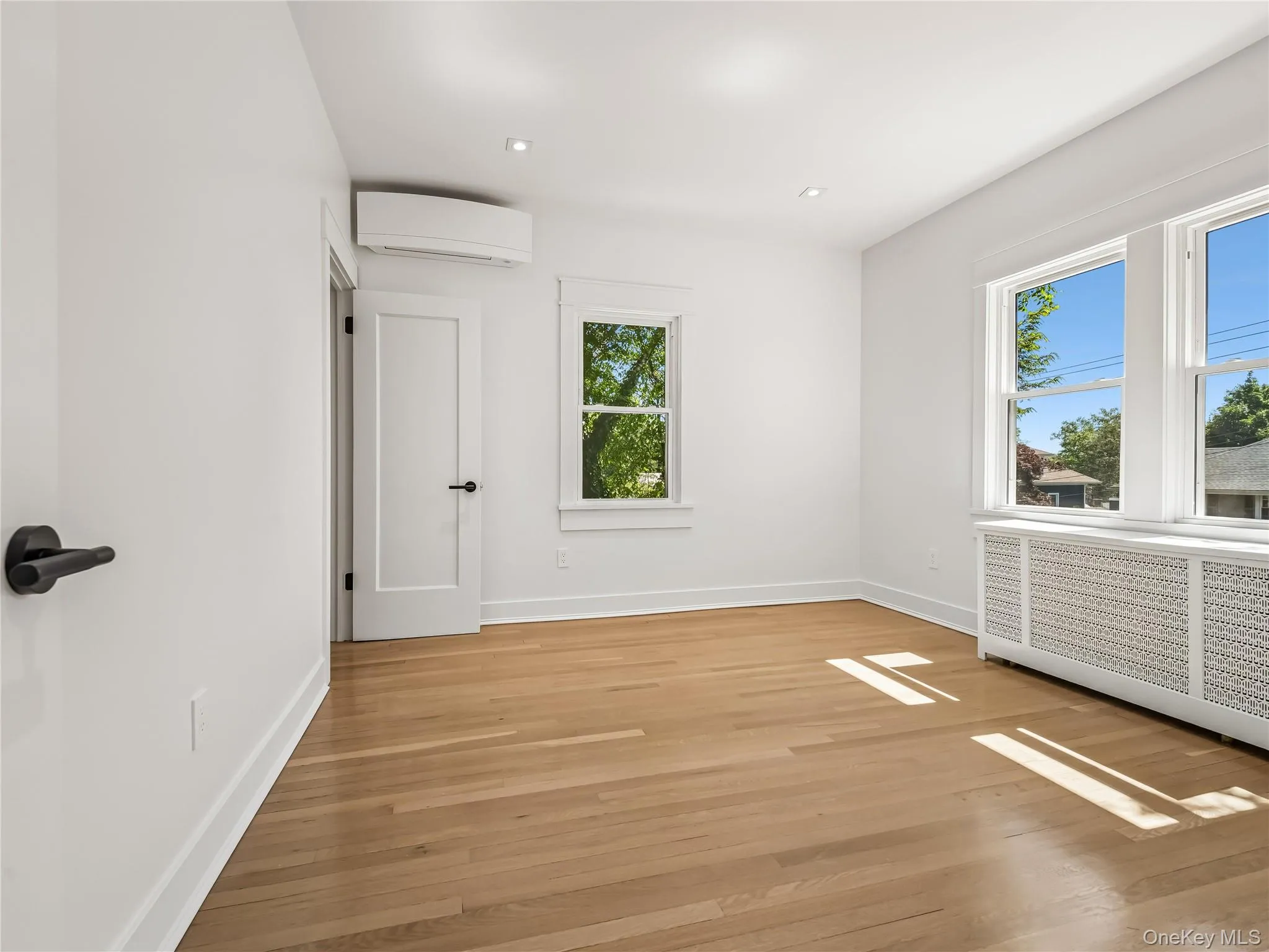 Large bedroom with closet, brand-new windows and split unit; all new lighting, electric, and insulation. Large bedroom with closet, brand-new windows and split unit; all new lighting, electric, and insulation.