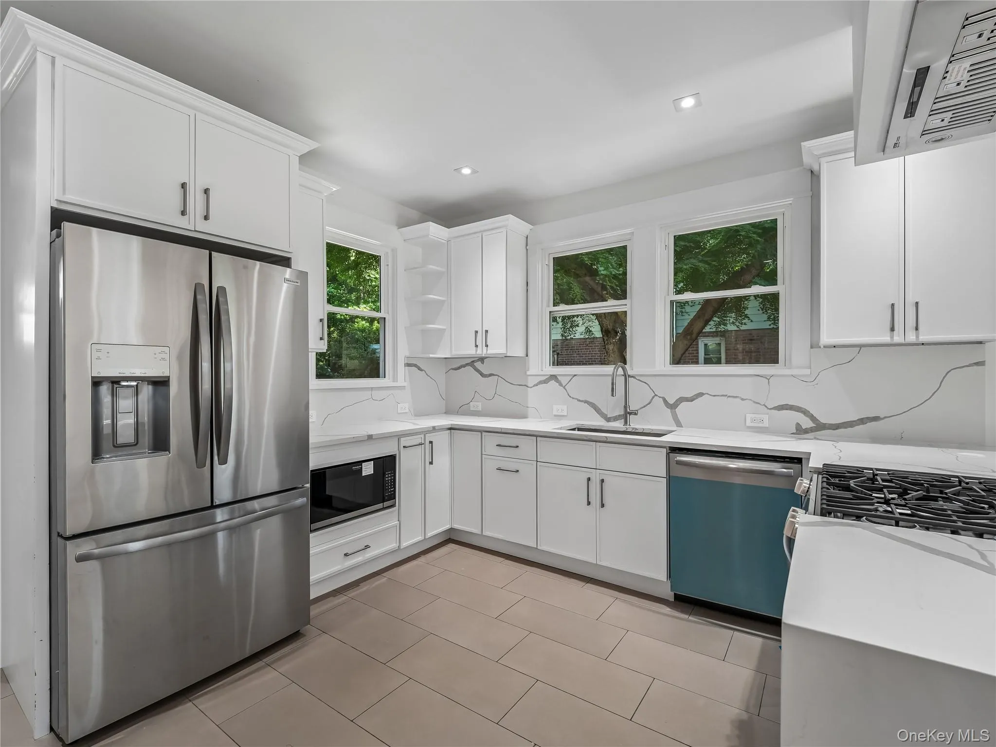 Fully remodeled kitchen with brand new windows, cabinets, waterfall quartz countertop and quartz backsplash open concept floor plan open to dining room, brand new appliances, flooring and lighting; all new plumbing, electric, insulation and split unit. Fully remodeled kitchen with brand new windows, cabinets, waterfall quartz countertop and quartz backsplash open concept floor plan open to dining room, brand new appliances, flooring and lighting; all new plumbing, electric, insulation and split unit.