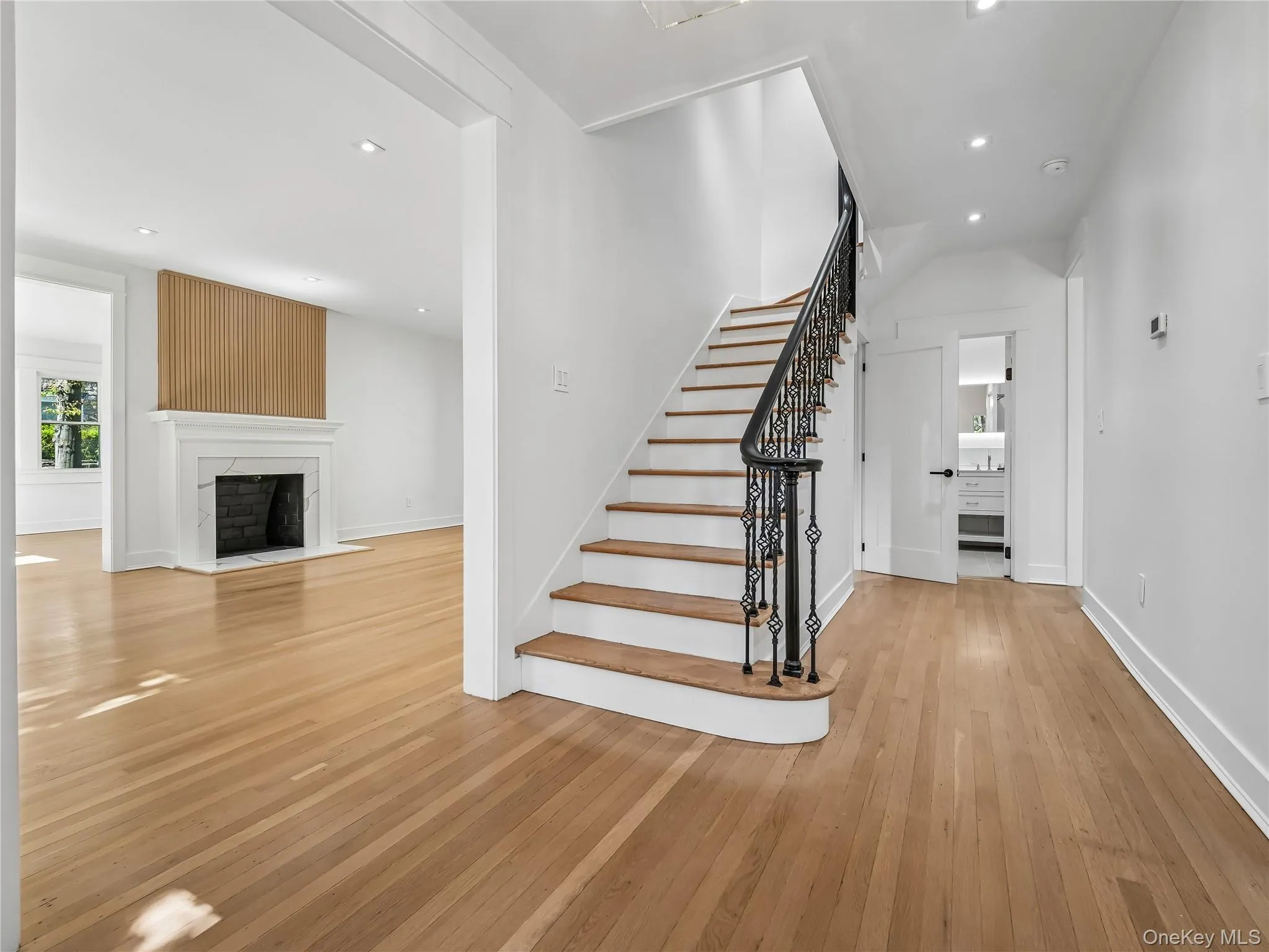 Sun-drenched first floor features nearly 9-foot ceilings and a seamless open-concept layout ideal for modern living and entertaining. Sun-drenched first floor features nearly 9-foot ceilings and a seamless open-concept layout ideal for modern living and entertaining.