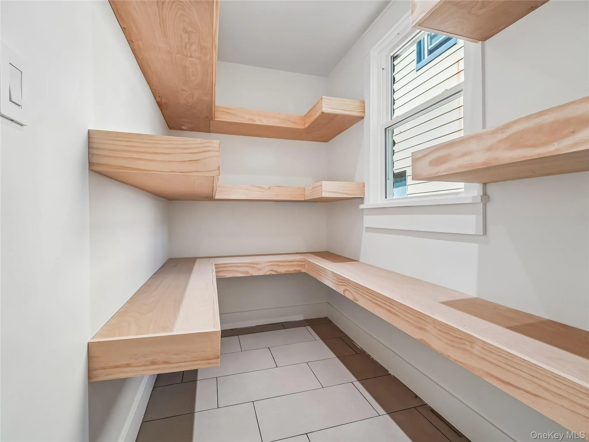 Fully remodeled pantry with custom wood shelving and brand-new window; all new flooring, lighting, plumbing, electric and insulation. Fully remodeled pantry with custom wood shelving and brand-new window; all new flooring, lighting, plumbing, electric and insulation.