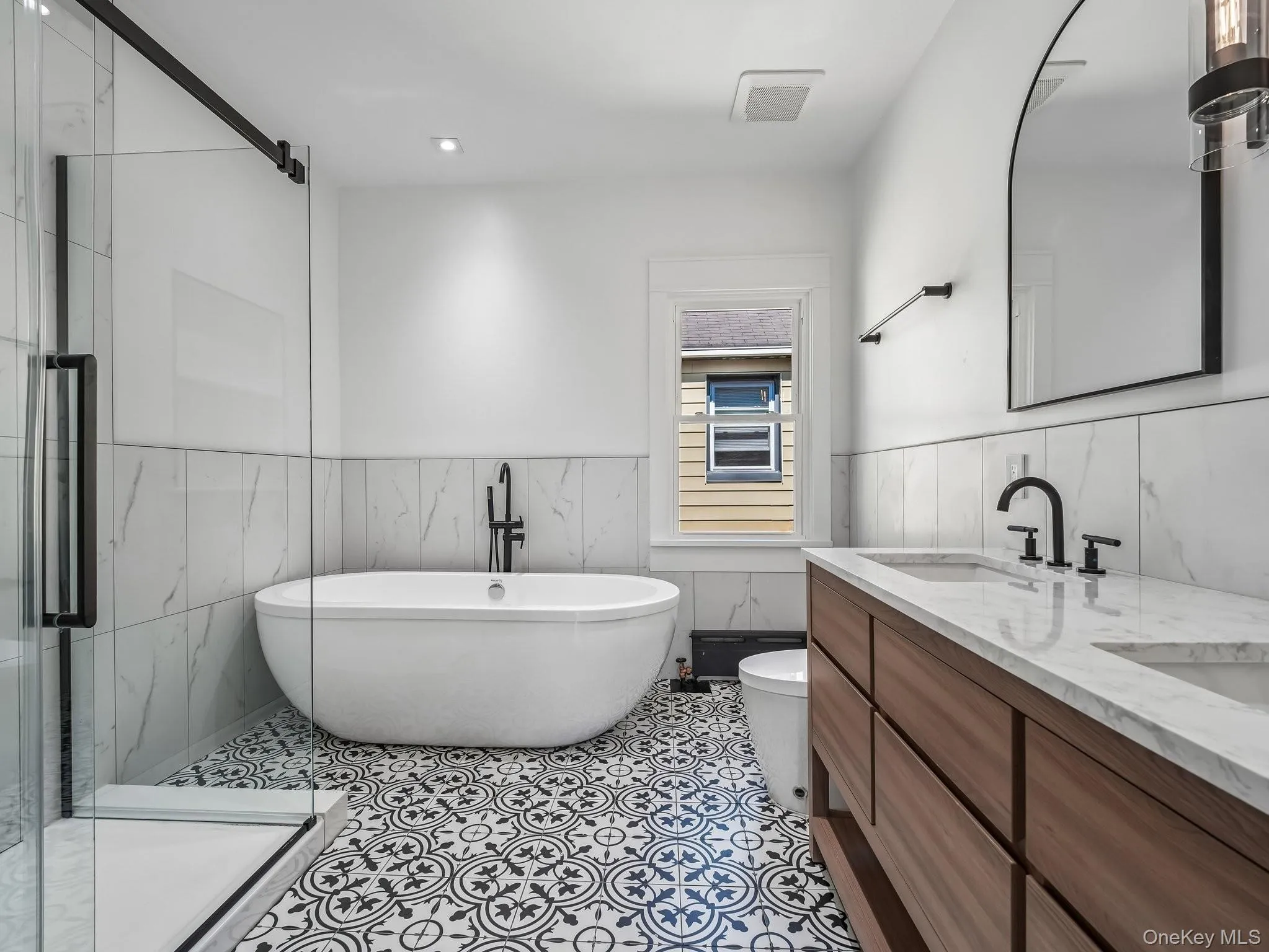 Brand new custom en-suite spa bathroom with double vanity, glass-enclosed shower, large soaking bathtub and bidet toilet; all new flooring, lighting, window, plumbing, electric, and insulation. Brand new custom en-suite spa bathroom with double vanity, glass-enclosed shower, large soaking bathtub and bidet toilet; all new flooring, lighting, window, plumbing, electric, and insulation.