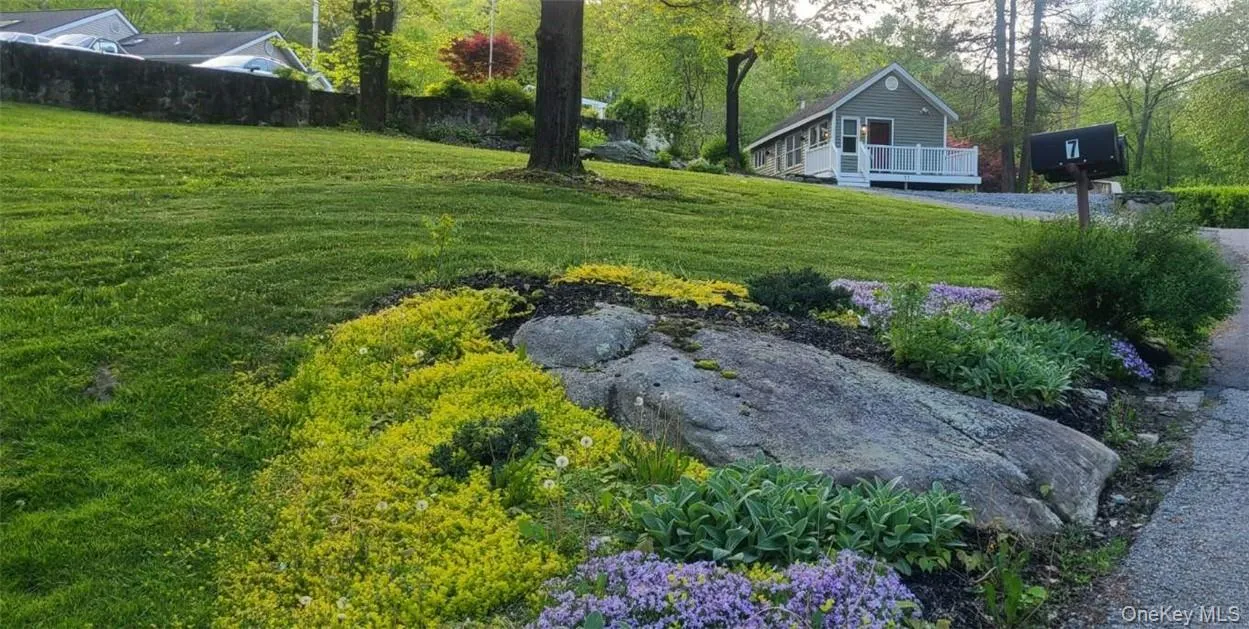 View of yard featuring a deck View of yard featuring a deck