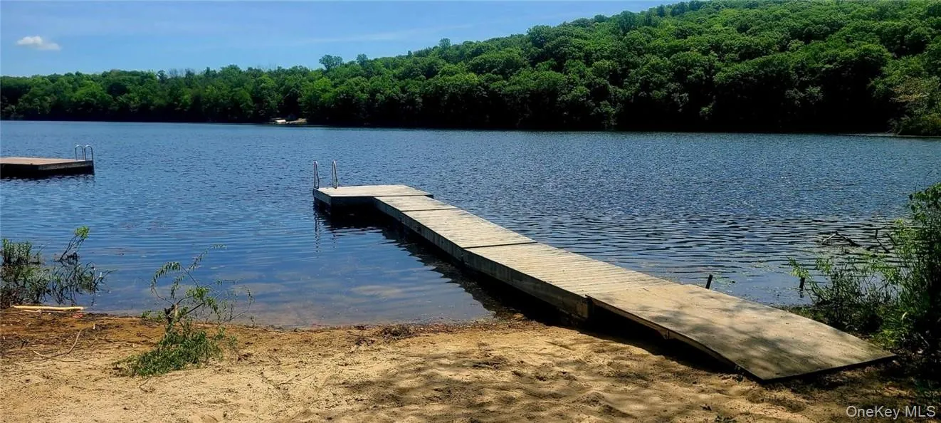 Dock area featuring a water view Dock area featuring a water view