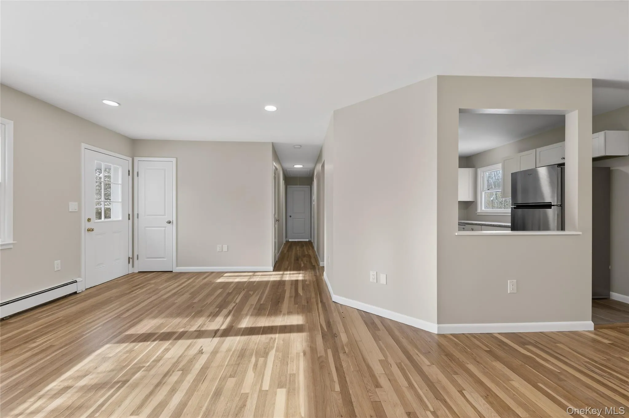 Gleaming, refinished hardwood floors, hallway to bedrooms Gleaming, refinished hardwood floors, hallway to bedrooms
