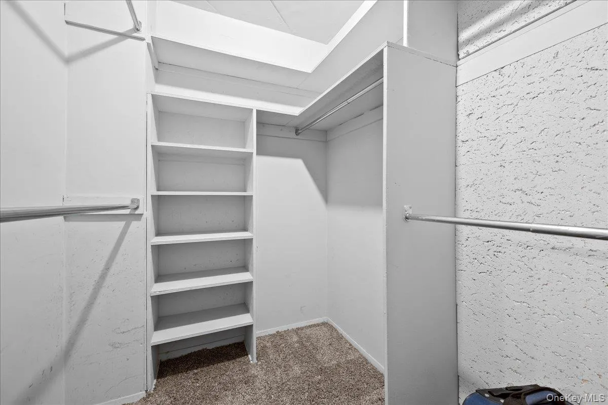 Walk in closet in primary bath Walk in closet in primary bath