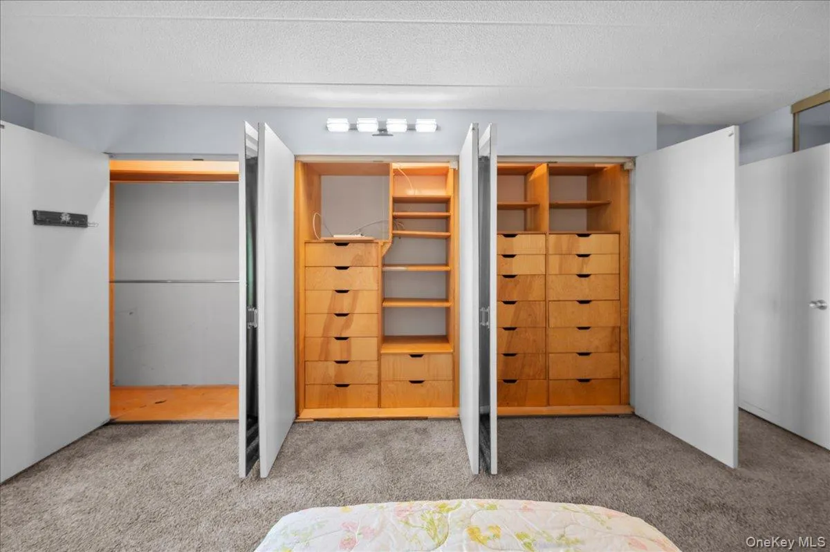 Customized closets in primary bedroom Customized closets in primary bedroom