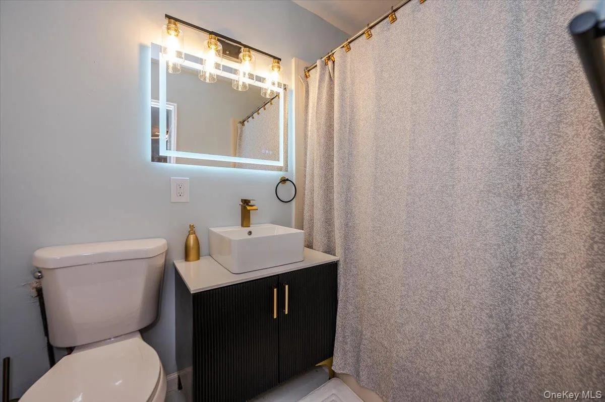 Full bathroom features new sink, vanity , light fixture, toilet, fresh paint and tiles flooring . Full bathroom features new sink, vanity , light fixture, toilet, fresh paint and tiles flooring .