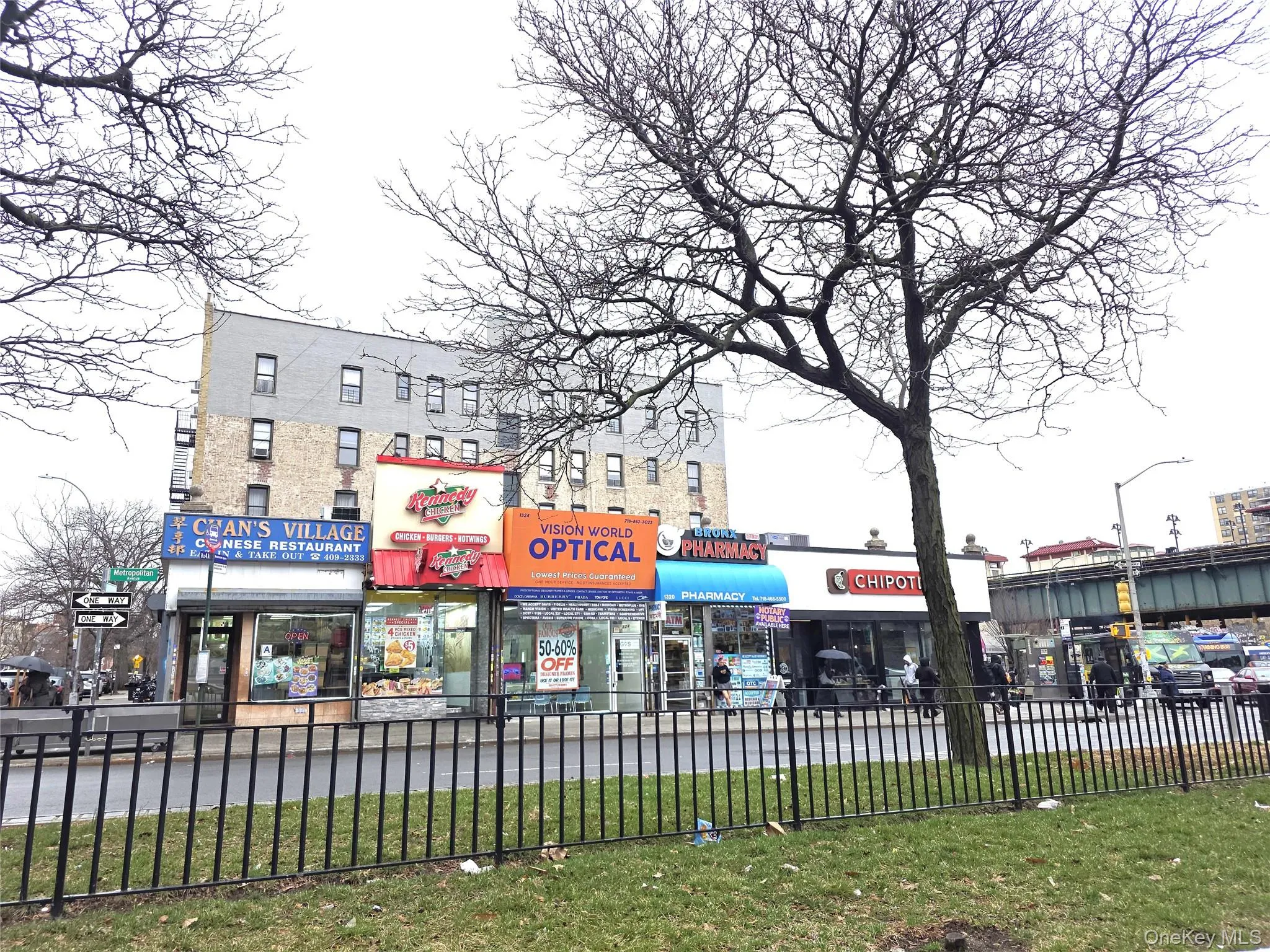 Street scene on Metropolitan Ave features numerous stores and shops. Street scene on Metropolitan Ave features numerous stores and shops.