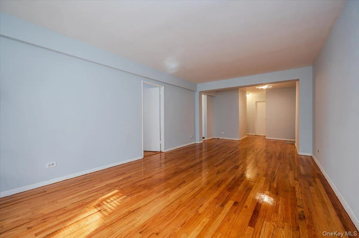 Livingroom area features fresh paint, new light fixture and polished hardwood floors. Livingroom area features fresh paint, new light fixture and polished hardwood floors.