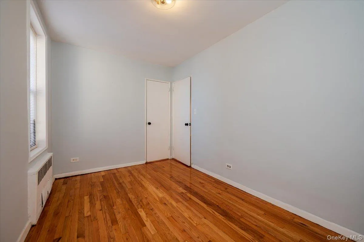 Bedroom room area features fresh paint, new light fixture and polished hardwood floors. Bedroom room area features fresh paint, new light fixture and polished hardwood floors.