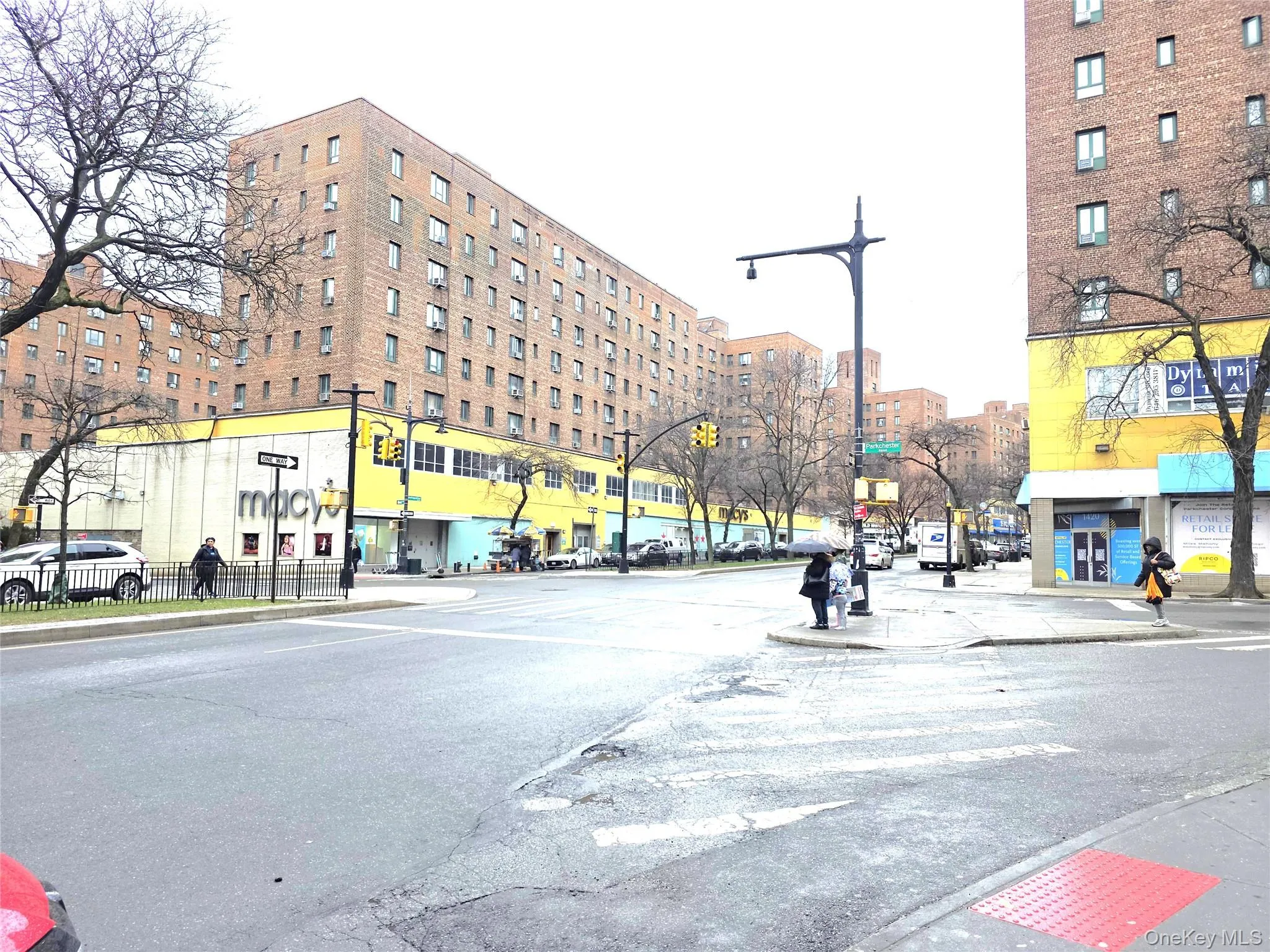 Street scene on Metropolitan Ave features numerous stores and shops. Street scene on Metropolitan Ave features numerous stores and shops.