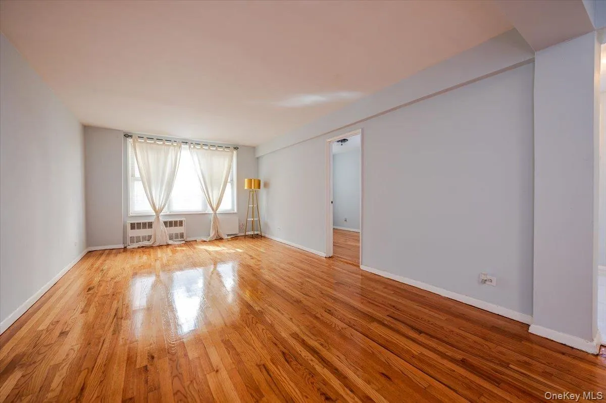 Livingroom area features fresh paint, new light fixture and polished hardwood floors. Livingroom area features fresh paint, new light fixture and polished hardwood floors.