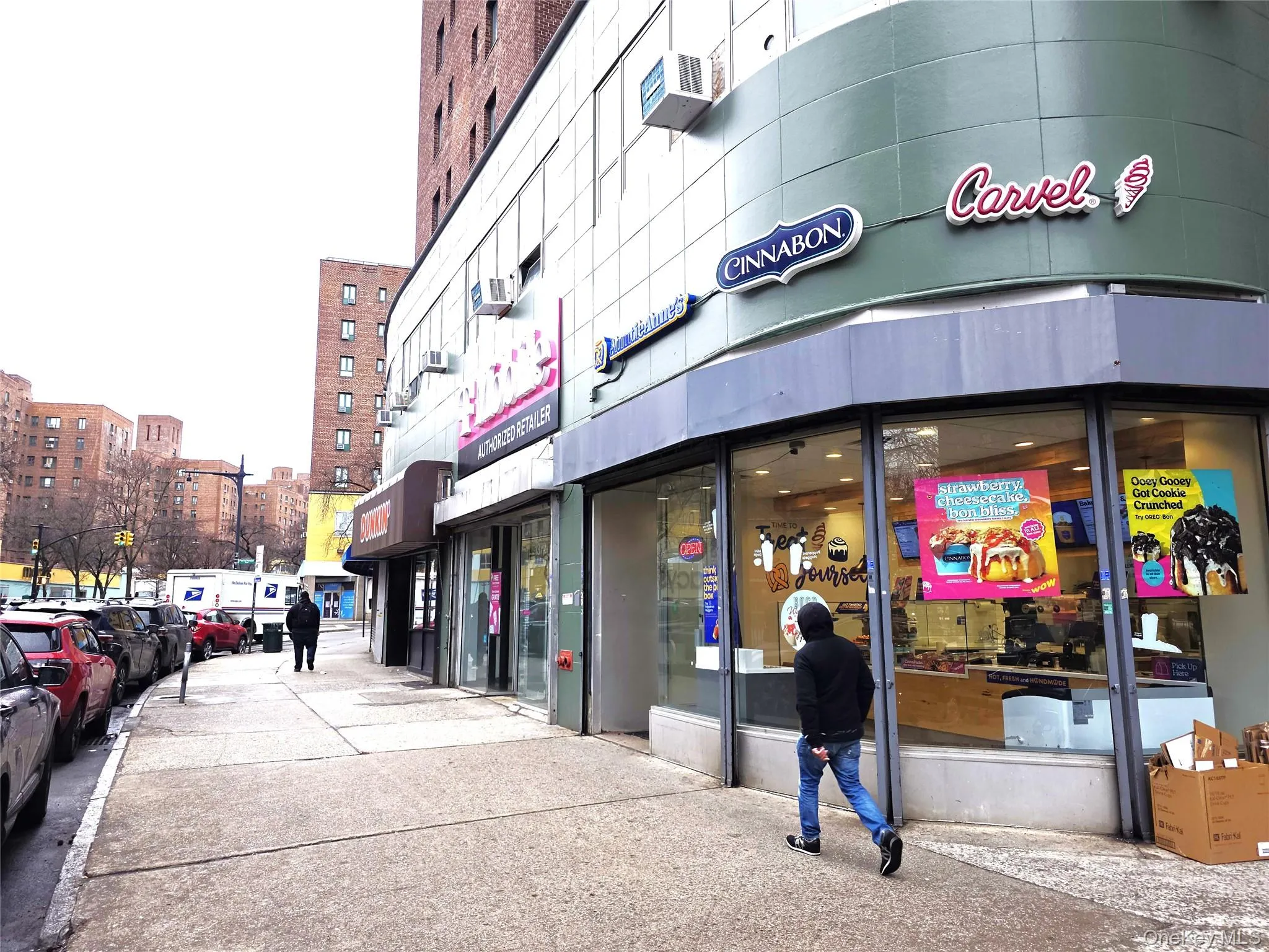 Street scene on Metropolitan Ave features numerous stores and shops. Street scene on Metropolitan Ave features numerous stores and shops.