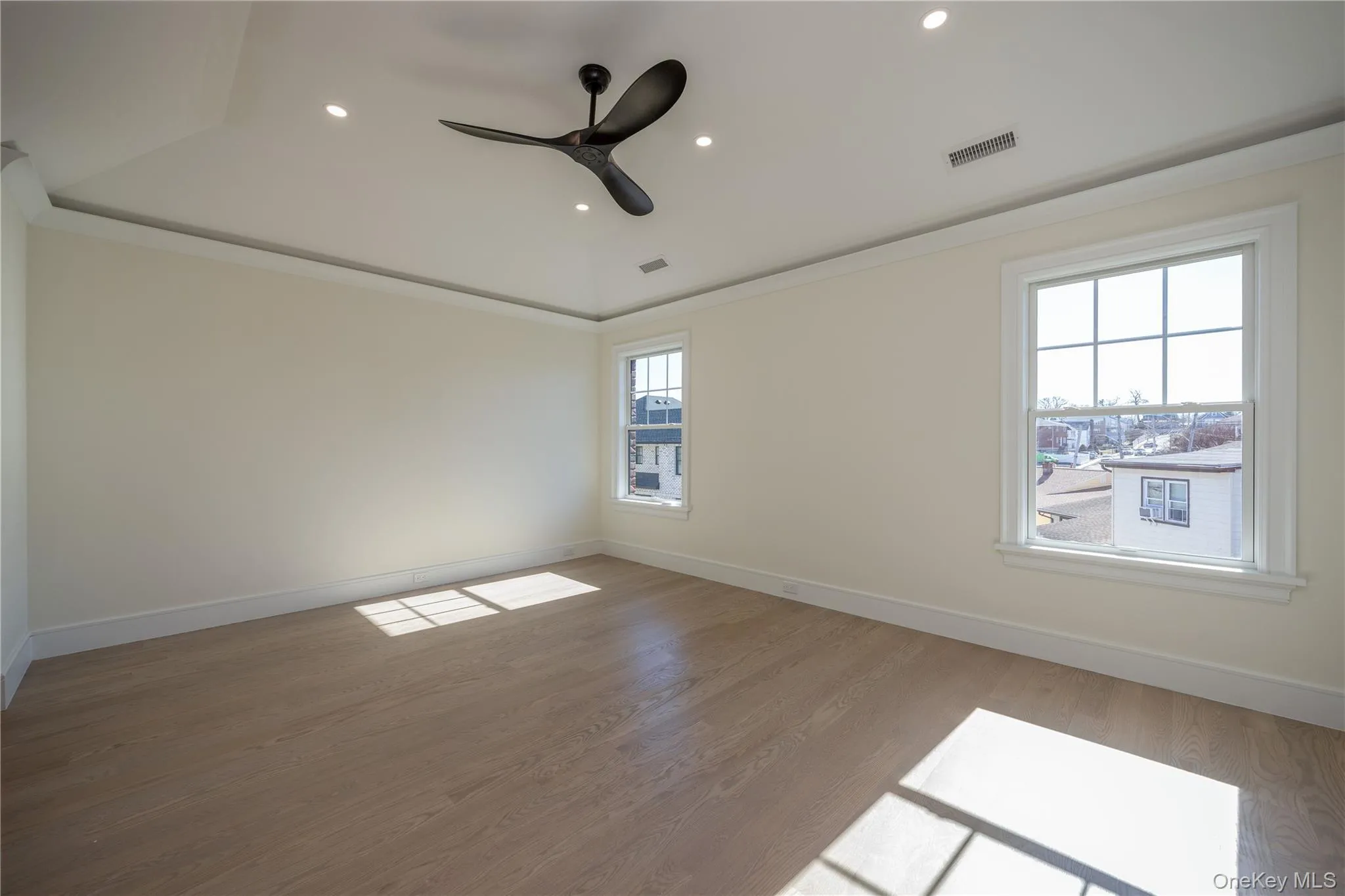 Primary suite with tray ceiling and ceiling fan Primary suite with tray ceiling and ceiling fan