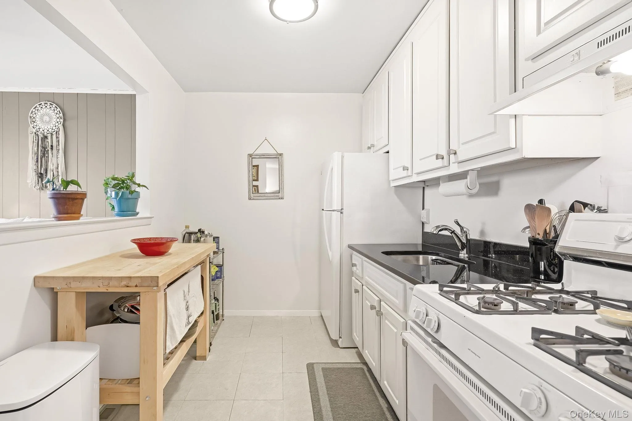 The updated kitchen with plenty of cabinets. The updated kitchen with plenty of cabinets.