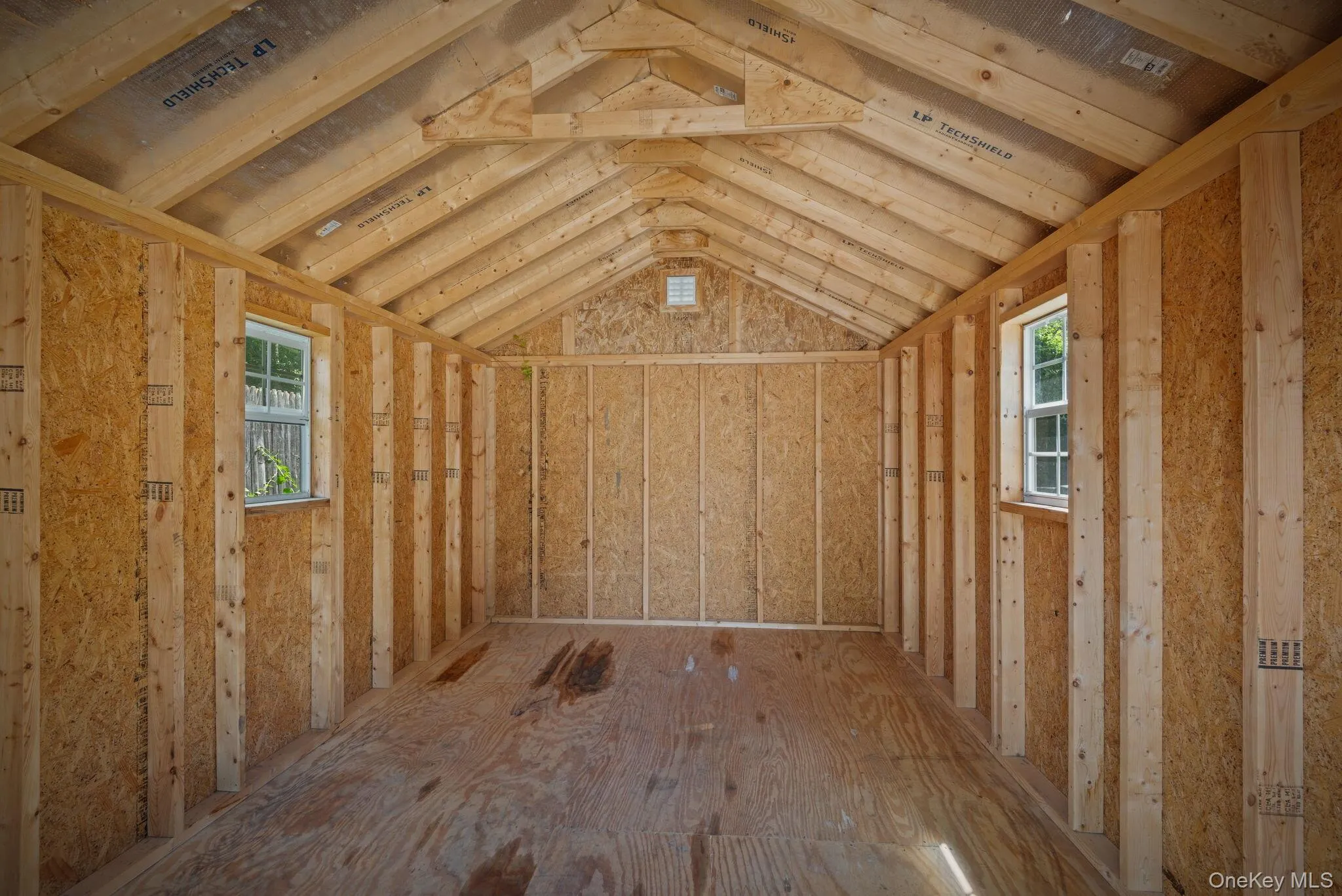 Interior of freestanding storage shed with windows Interior of freestanding storage shed with windows
