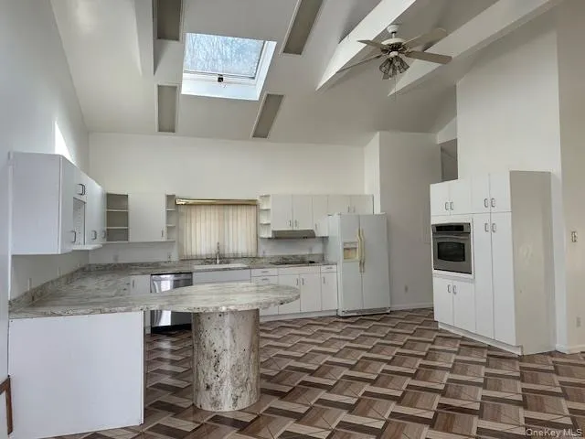 Tiled kitchen and dining area Tiled kitchen and dining area