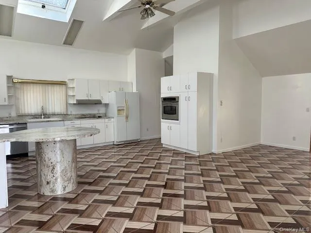 Tiled dining area and kitchen Tiled dining area and kitchen