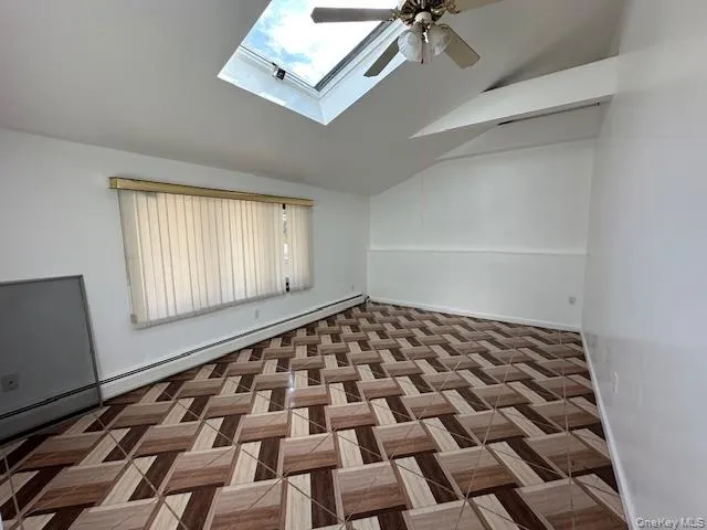 Large bedroom with high ceilings and skylight Large bedroom with high ceilings and skylight