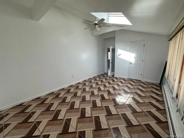 Large bedroom with high ceilings and skylight Large bedroom with high ceilings and skylight