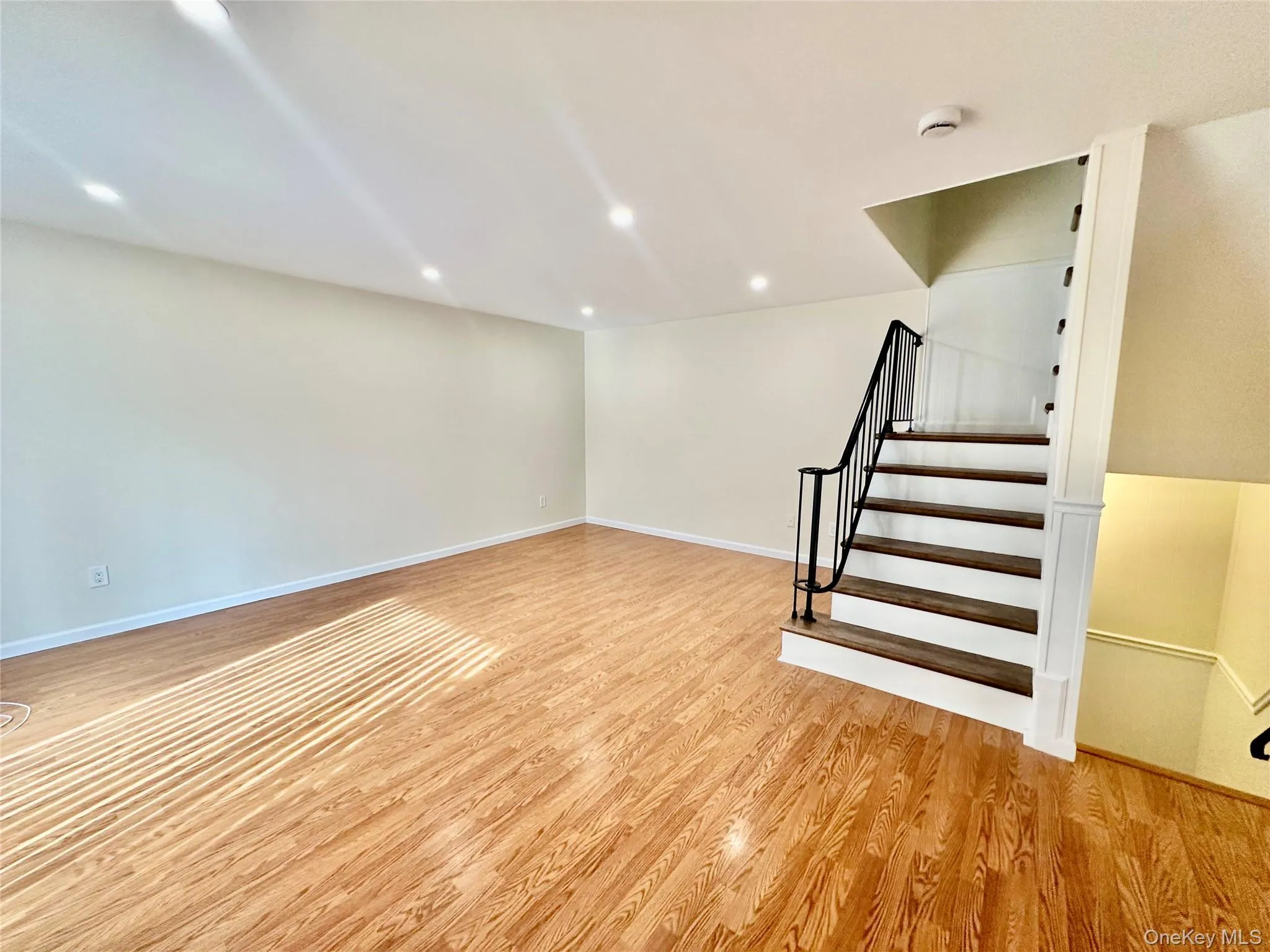 Living room with plenty of natural light and brand new recessed lighting Living room with plenty of natural light and brand new recessed lighting