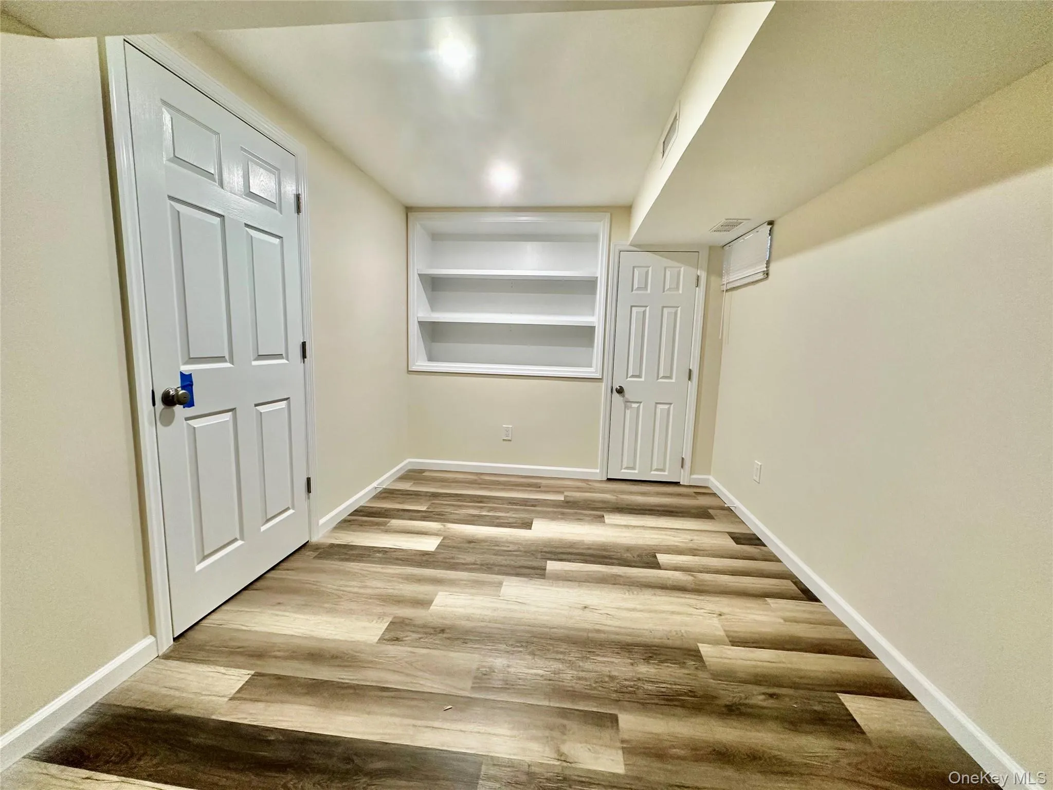 Office on the lower level leading to utility/laundry room Office on the lower level leading to utility/laundry room