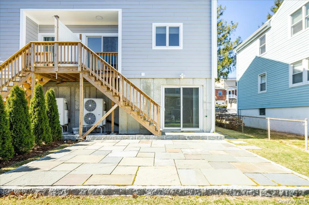 Back of house with fence, stairs, and a patio area Back of house with fence, stairs, and a patio area