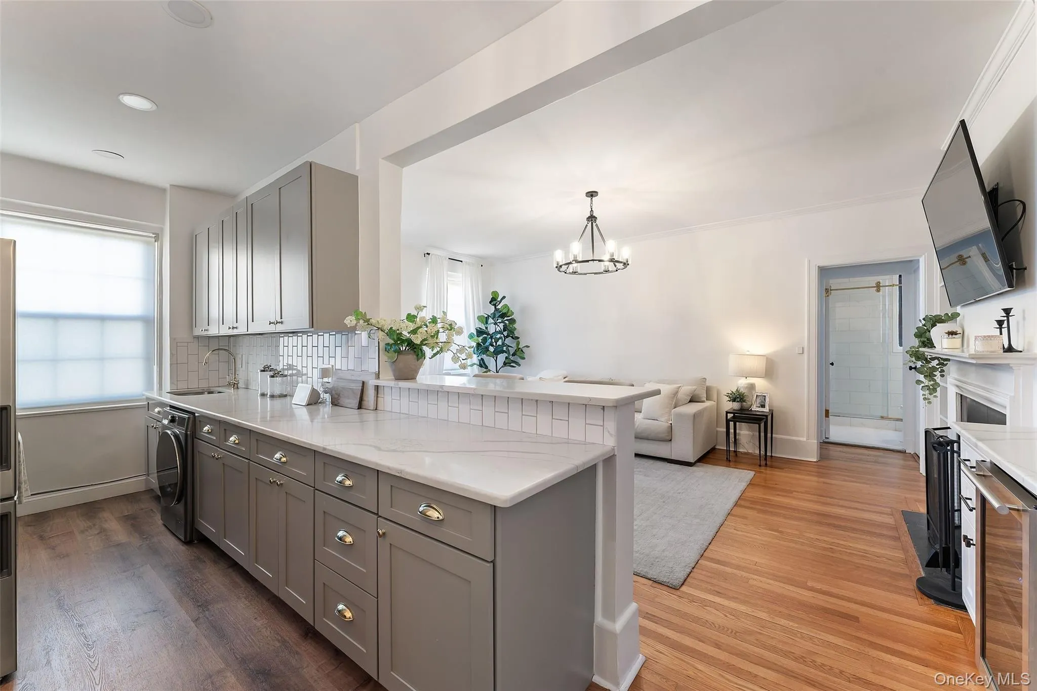 Fully updated Kitchen featuring hardwood floors, quartz countertop, ample cabinetry and opens into Living Room. Fully updated Kitchen featuring hardwood floors, quartz countertop, ample cabinetry and opens into Living Room.