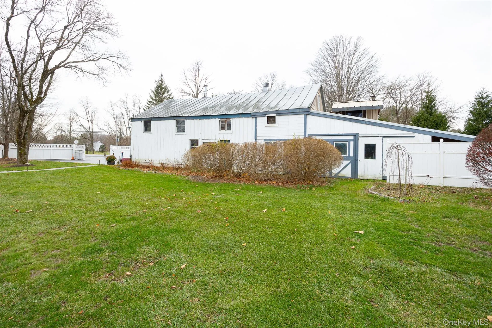Rear view of property with an outbuilding Rear view of property with an outbuilding