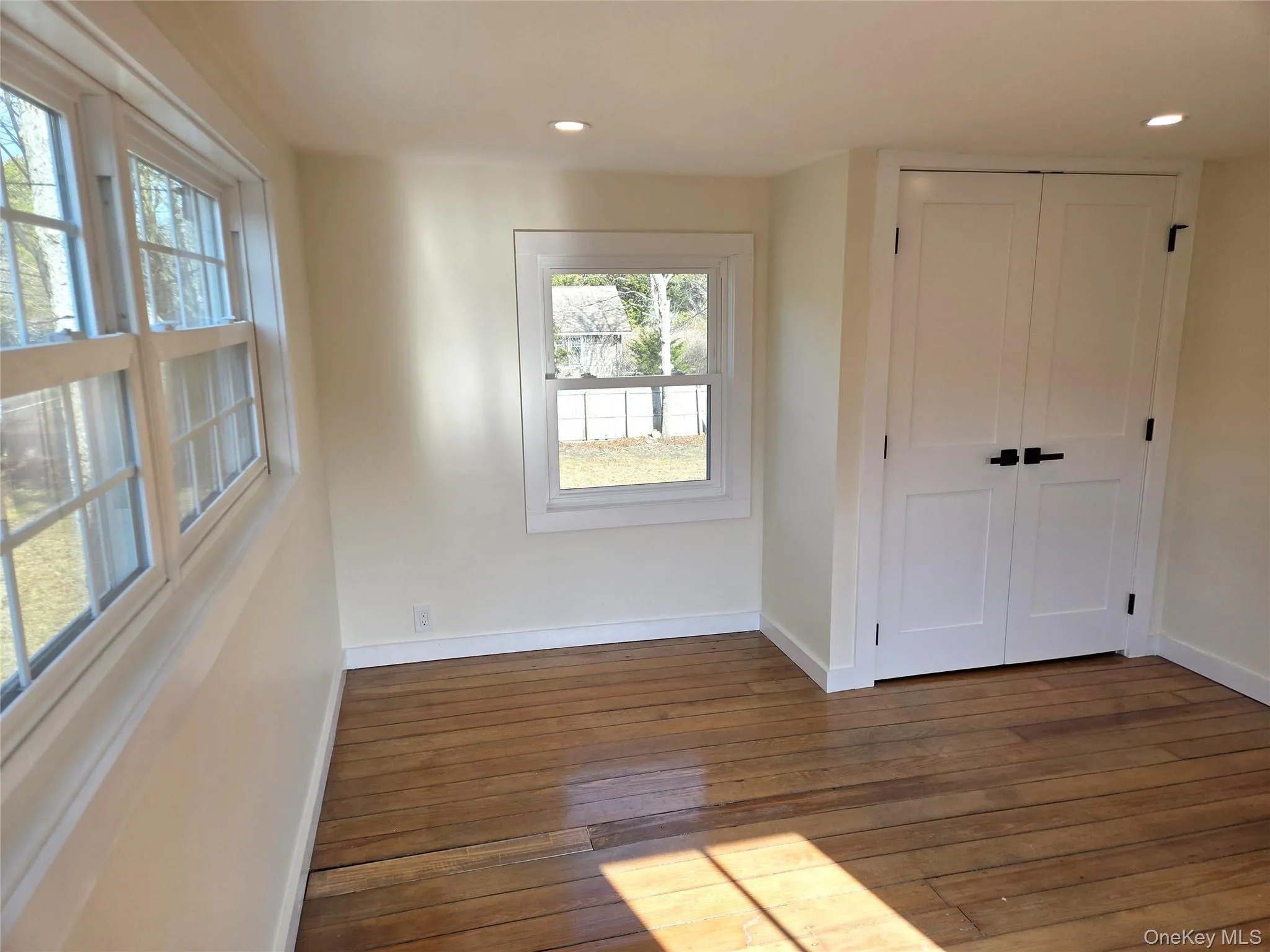 The Second Bedroom Offers All Beautiful Windows For Natural Light, Original Wide Plank Wood Floors, Recessed Lighting & A Double Sized Closet. The Second Bedroom Offers All Beautiful Windows For Natural Light, Original Wide Plank Wood Floors, Recessed Lighting & A Double Sized Closet.