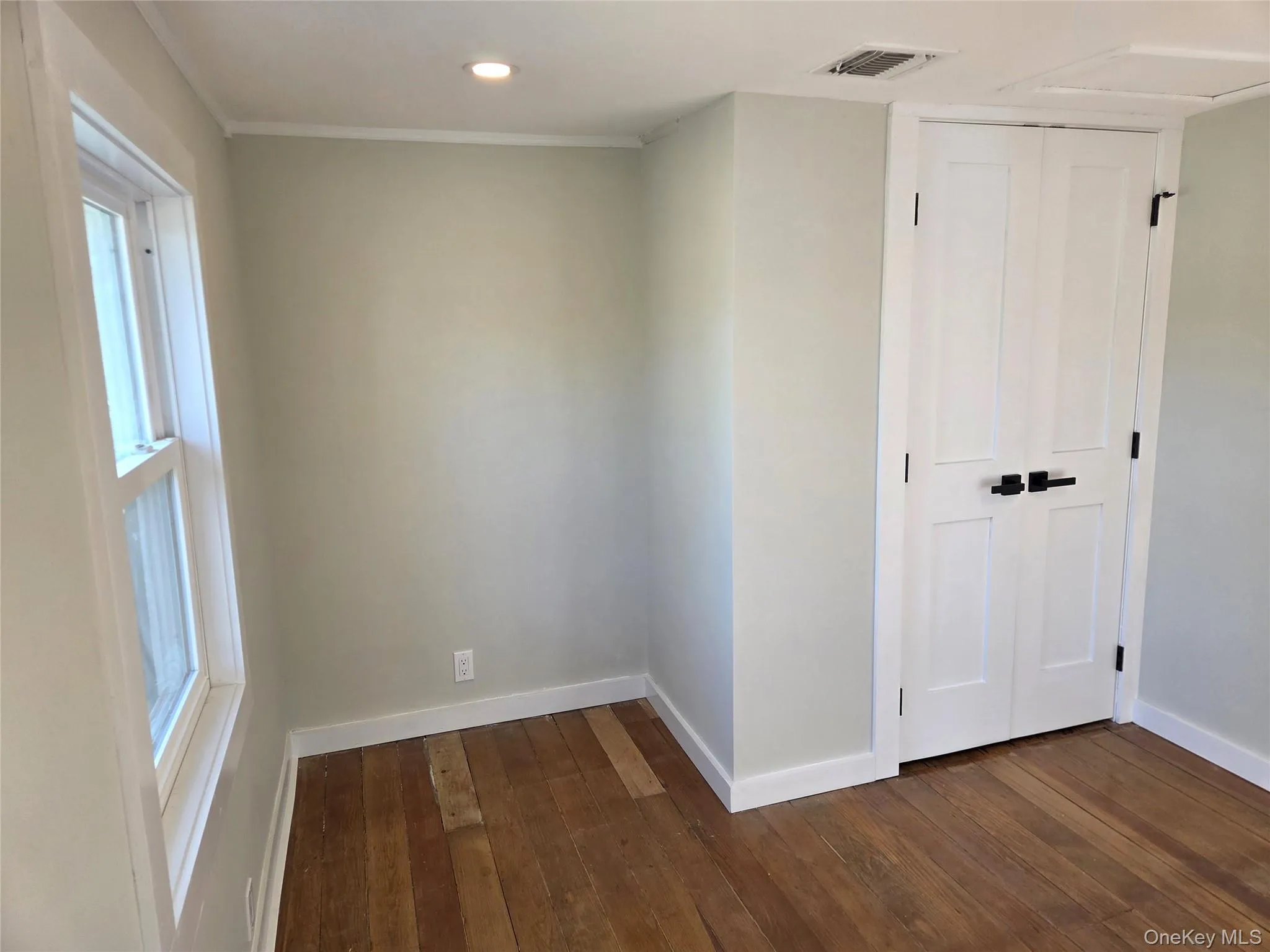 Another View Of The Third Bedroom Offering Original Wide Plank Wood Floors, A Double Sized Closet, Recessed Lighting & A Large Window For Natural Light. Another View Of The Third Bedroom Offering Original Wide Plank Wood Floors, A Double Sized Closet, Recessed Lighting & A Large Window For Natural Light.