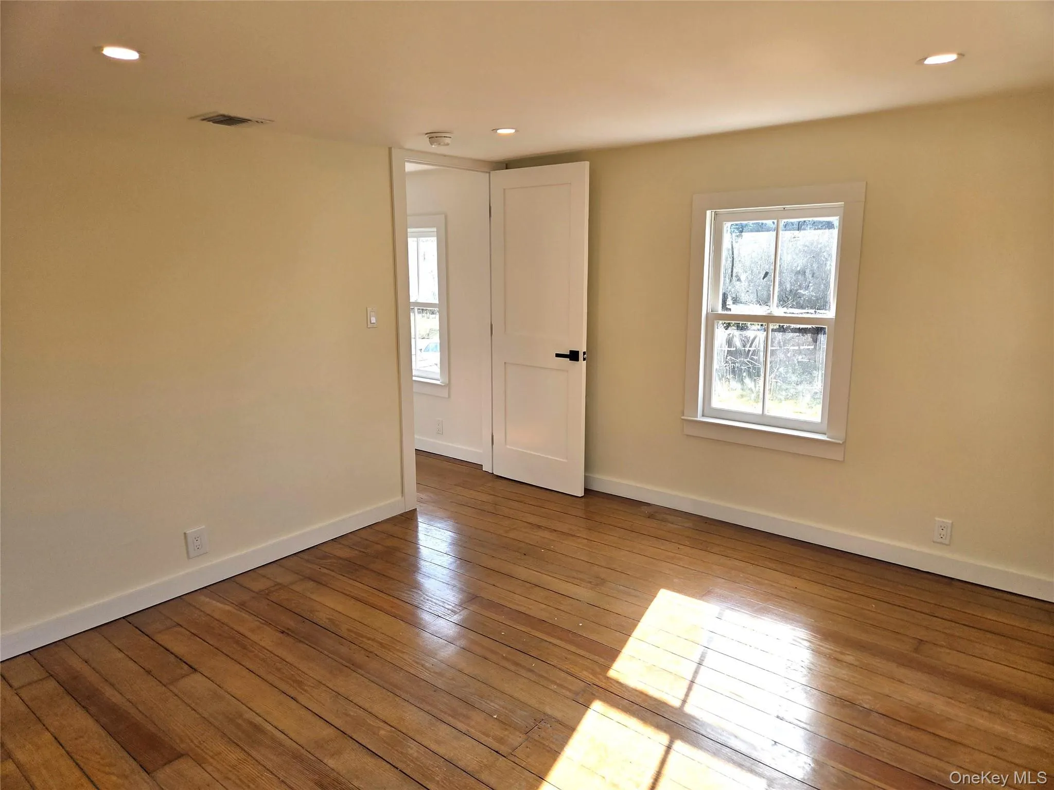The Well Sized Second Bedroom Offers Original Wide Plank Wood Floors, Lots Of Windows For Natural Light, Recessed Lighting & A Double Sized Closet. The Well Sized Second Bedroom Offers Original Wide Plank Wood Floors, Lots Of Windows For Natural Light, Recessed Lighting & A Double Sized Closet.