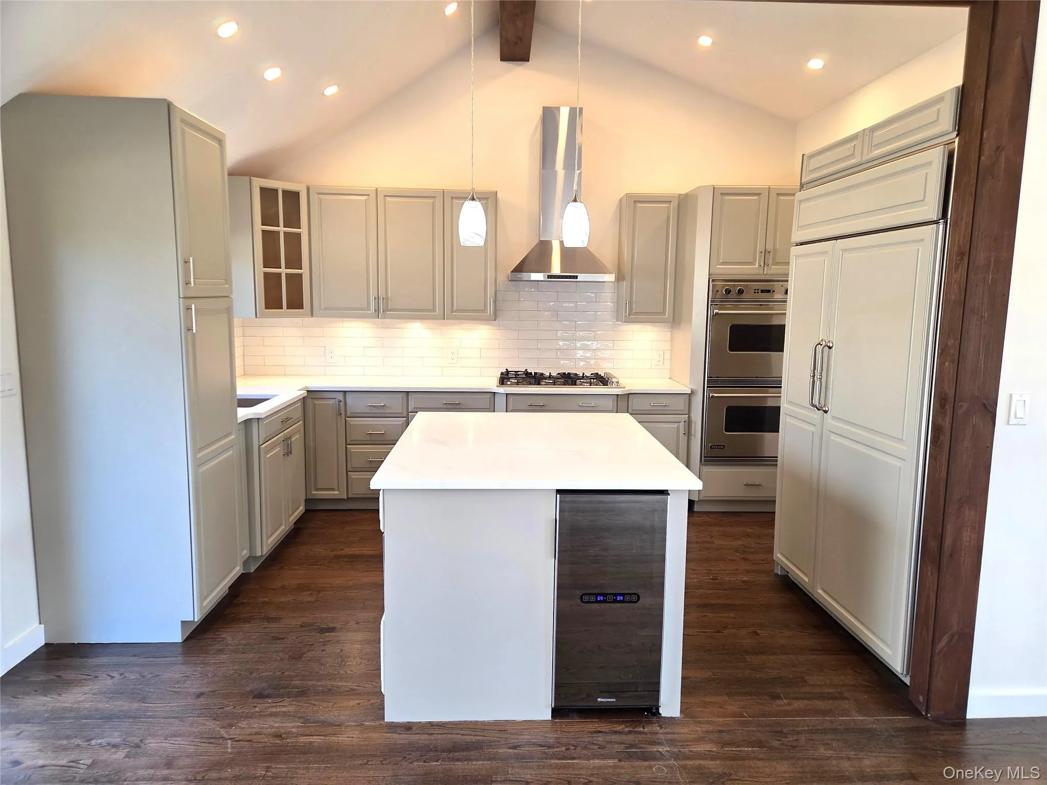 The Centerpiece Of The Custom Chef's Kitchen Is A 56" x 48" Center Island With Quartz Countertop & Built In Wine Refrigerator...Perfect For Preparing & Placing Food & Drinks While Entertaining Friends & Family. The Centerpiece Of The Custom Chef's Kitchen Is A 56" x 48" Center Island With Quartz Countertop & Built In Wine Refrigerator...Perfect For Preparing & Placing Food & Drinks While Entertaining Friends & Family.