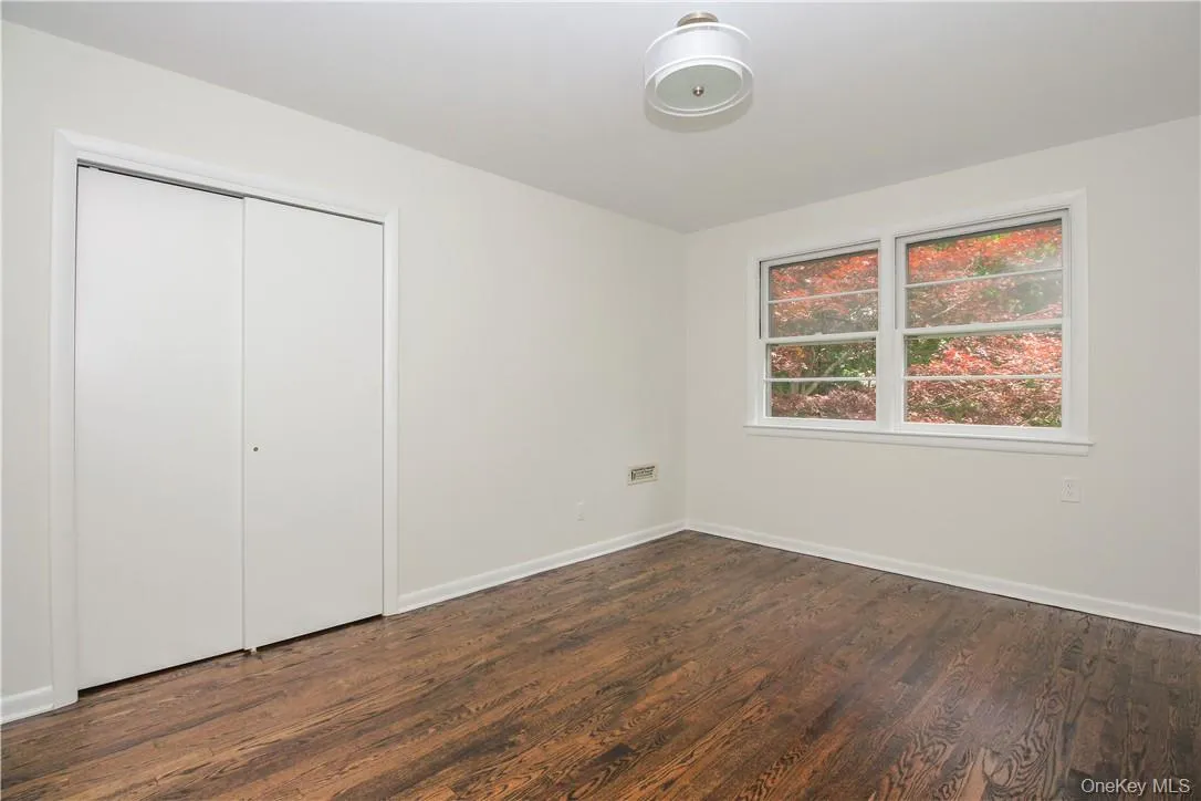 Bedroom with double closet facing back yard Bedroom with double closet facing back yard