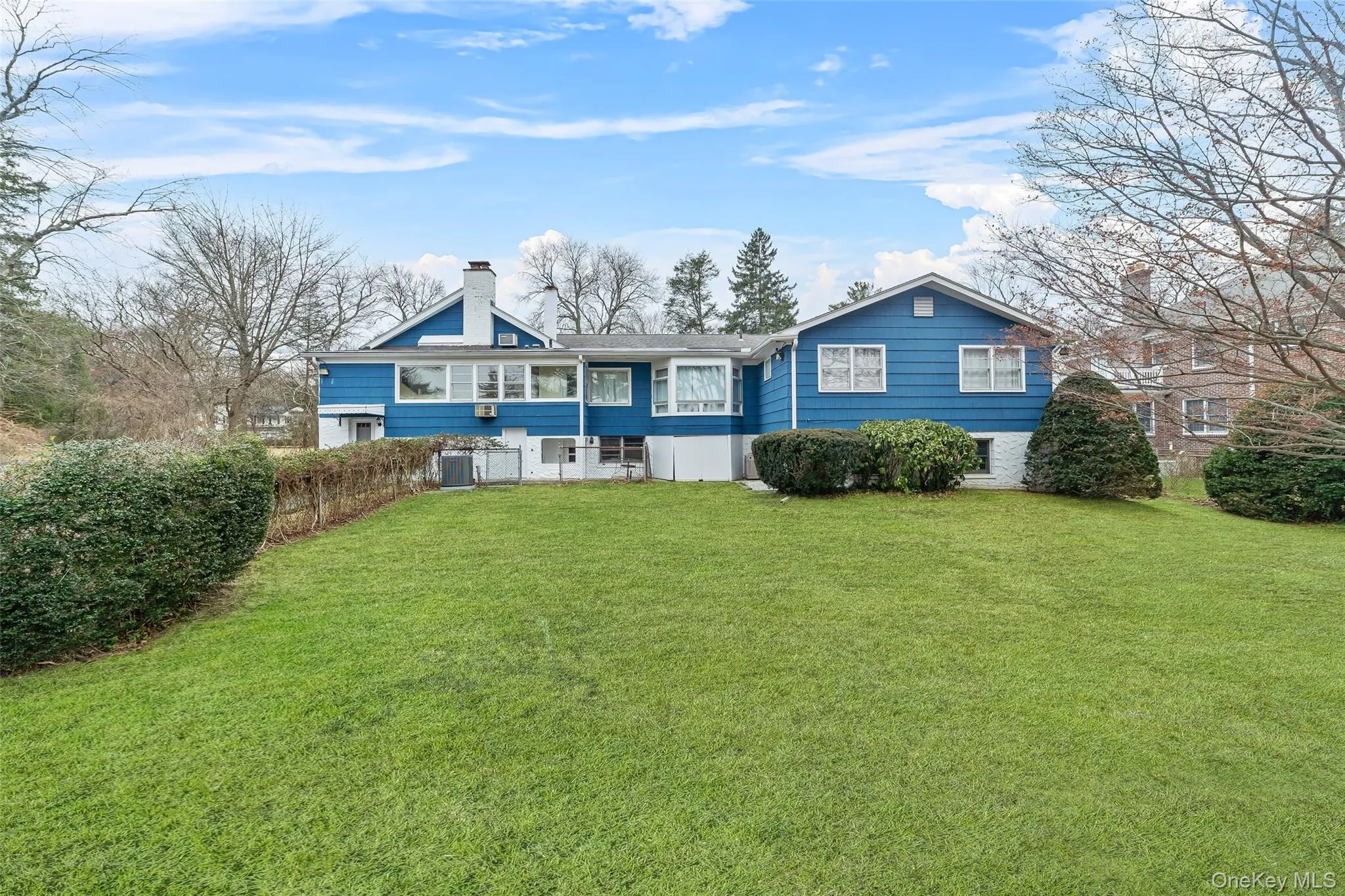 Back of house featuring a huge lawn Back of house featuring a huge lawn