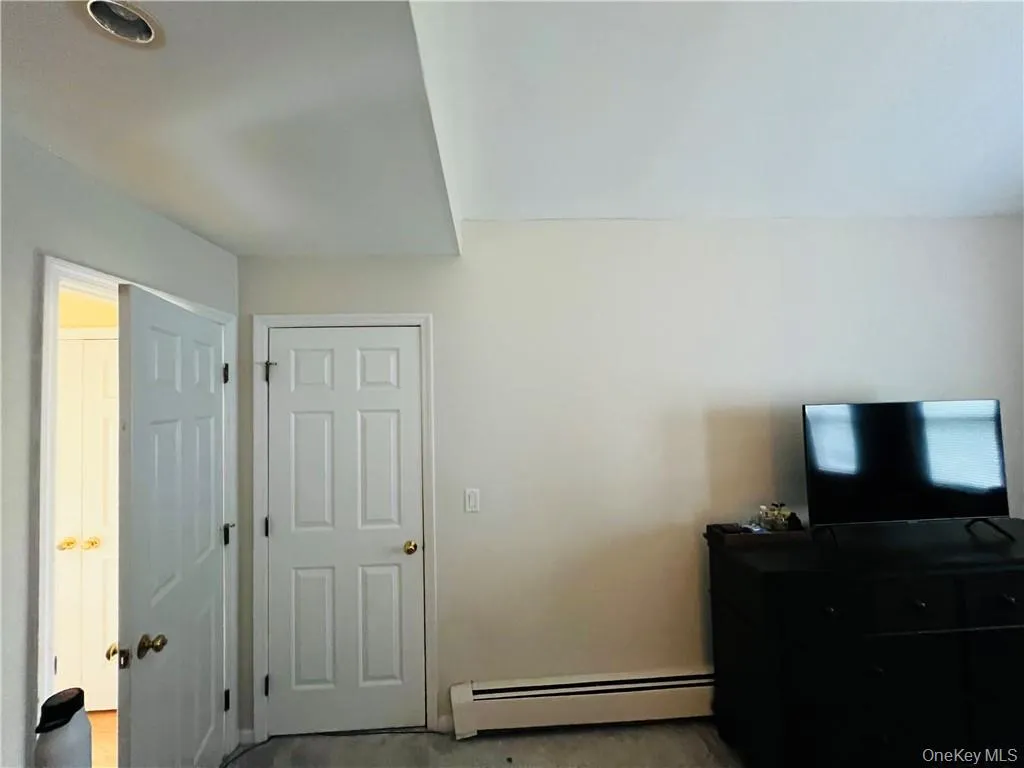 2nd Bedroom featuring baseboard heating 2nd Bedroom featuring baseboard heating