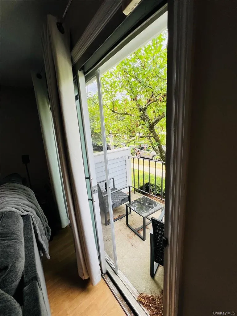 Doorway featuring light hardwood / wood-style flooring Doorway featuring light hardwood / wood-style flooring