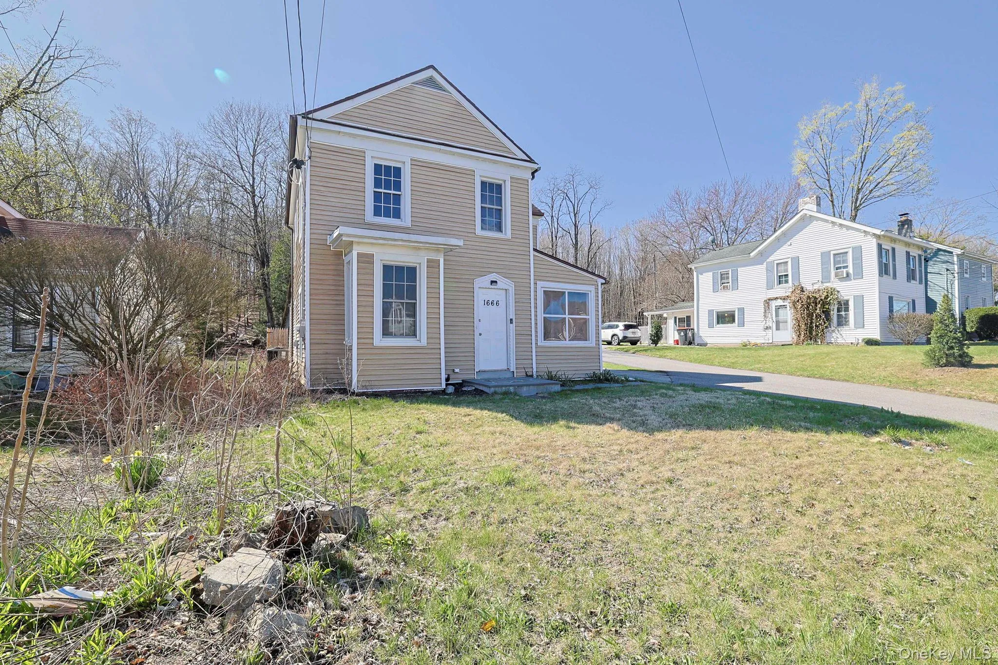 Traditional-style home featuring a front lawn Traditional-style home featuring a front lawn