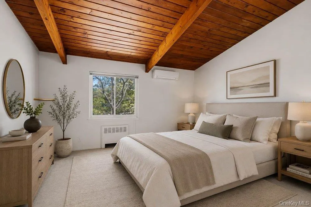 Vaulted wood-plank ceiling with exposed beams Vaulted wood-plank ceiling with exposed beams
